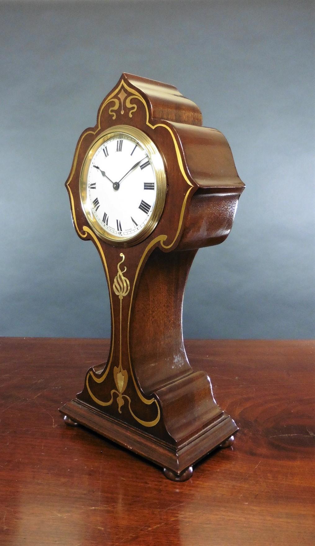 Art Nouveau mahogany mantel clock


Art Nouveau balloon clock standing on a raised plinth and resting on four bun feet in a fine mahogany case with brass and mother of pearl decorative inlay.


Enamel dial with Roman numerals, original ‘blued’