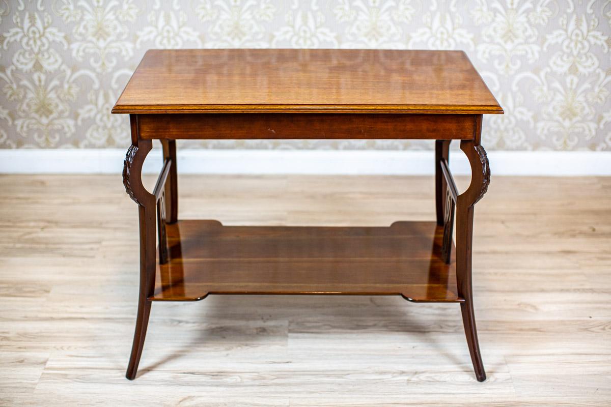 Early 20th Century Art Nouveau Mahogany Brown Living Room Coffee Table

We present you this mahogany coffee table from the early 20th century.
The rectangular top is supported on saber-like legs, with arch knees covered with carved patterns.
At the