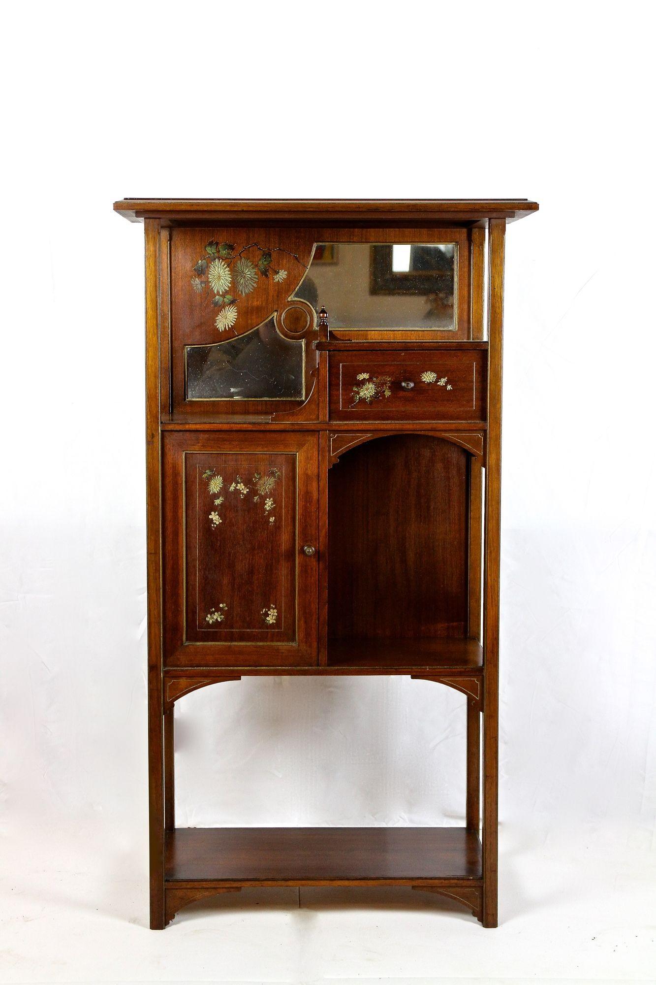 Superb Art Nouveau display cabinet or etagere made out of fine mahogany in France around 1900. The unique, breathtaking design, reflecting the form language of the famous Art Nouveau period at its best, makes this extraordinary antique display