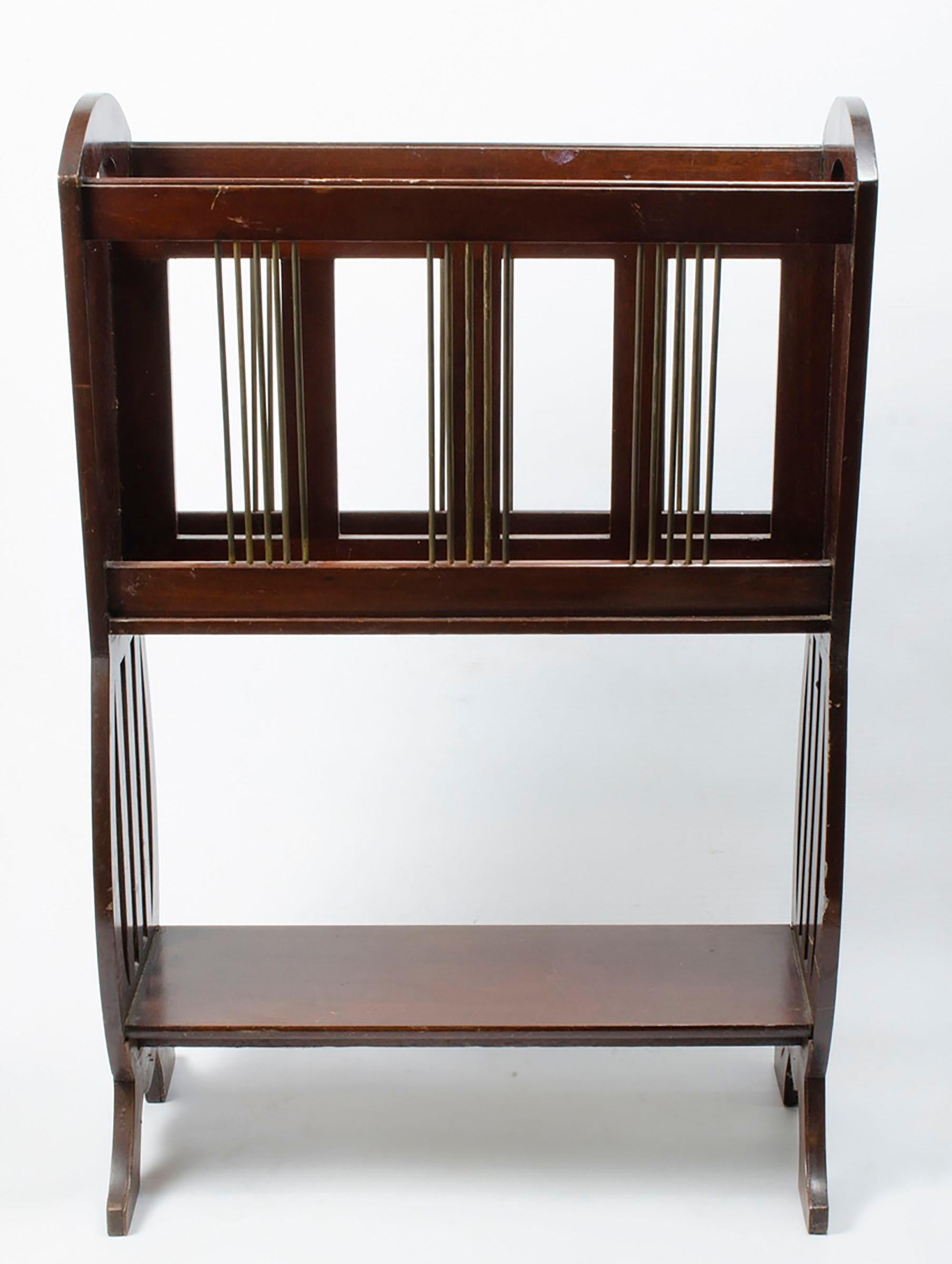 Beautiful Art Nouveau Magazine Rack

This very attractive furniture, Art Nouveau magazine rack in mahogany, having elegant, brass supports and inlaid and slatted side united by undertier, all in original 
condition throughout. C1910
