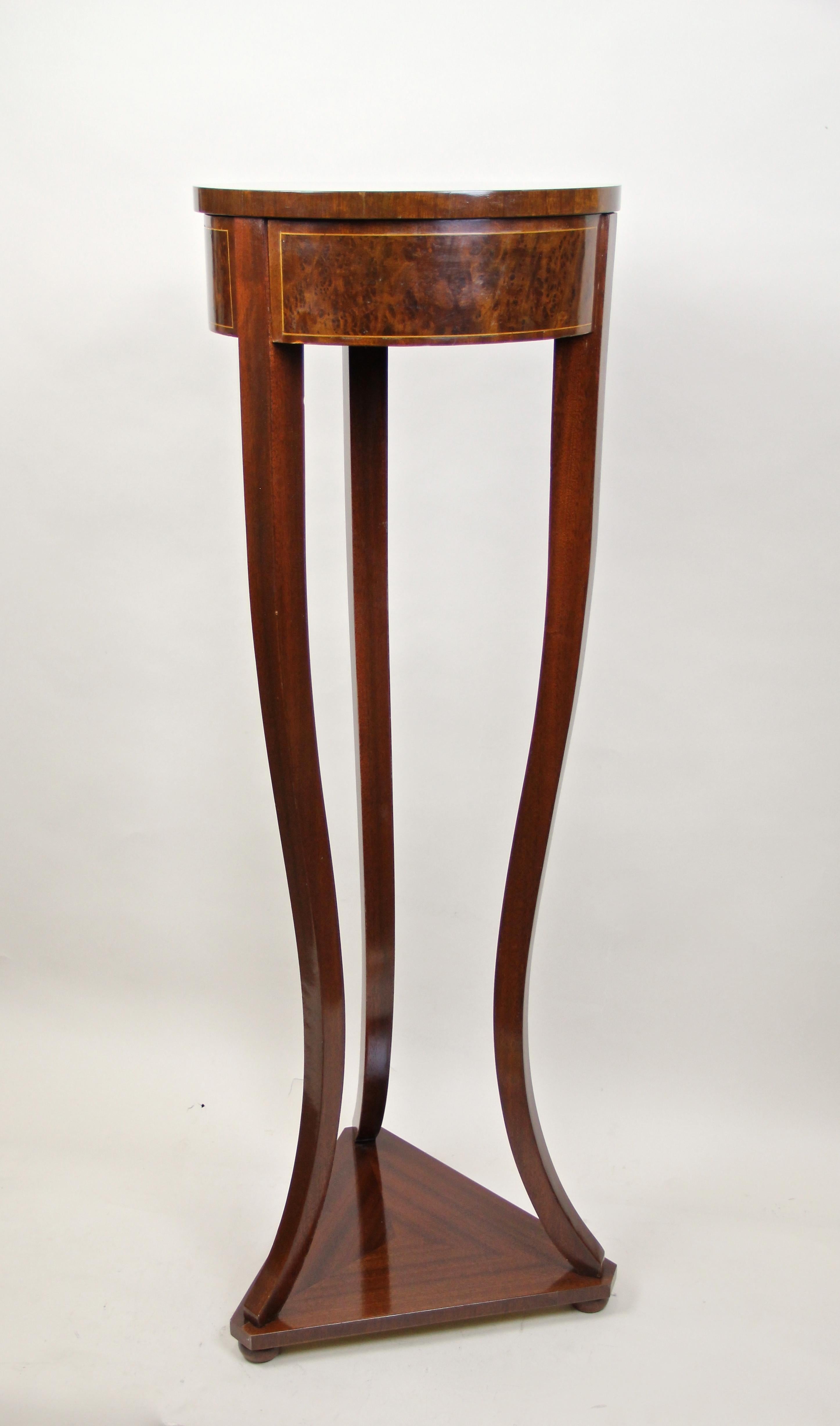 Exceptional Art Nouveau mahogany pedestal with inlayed bird's-eye maple, made in Austria, circa 1915. This timeless pedestal represents the classical form language of the famous Art Nouveau period best. Standing on a great looking triangle base