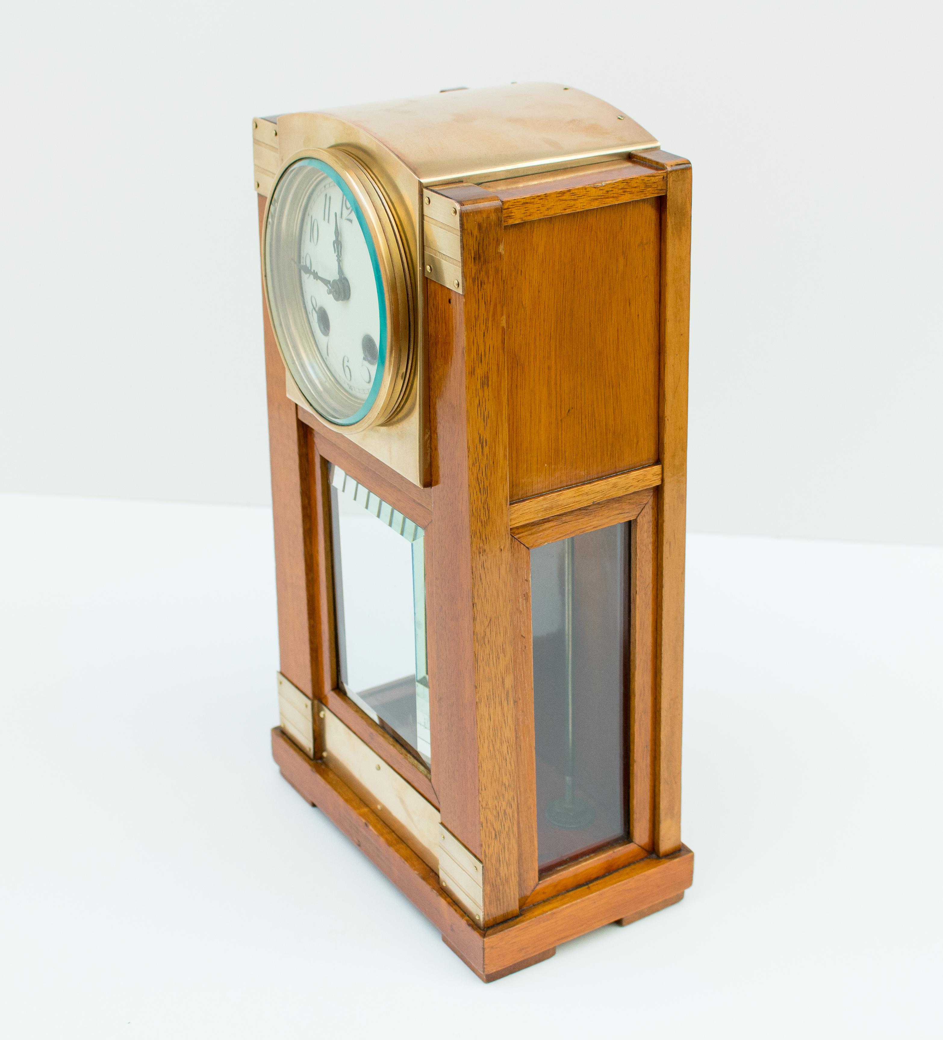 Beautiful Art Nouveau table / chimney clock from the Art Nouveau period, circa 1900. The watch case is made of mahogany wood with brass fittings. 

The clock is very well restored and has been overhauled by a master watchmaker. 

The movement was