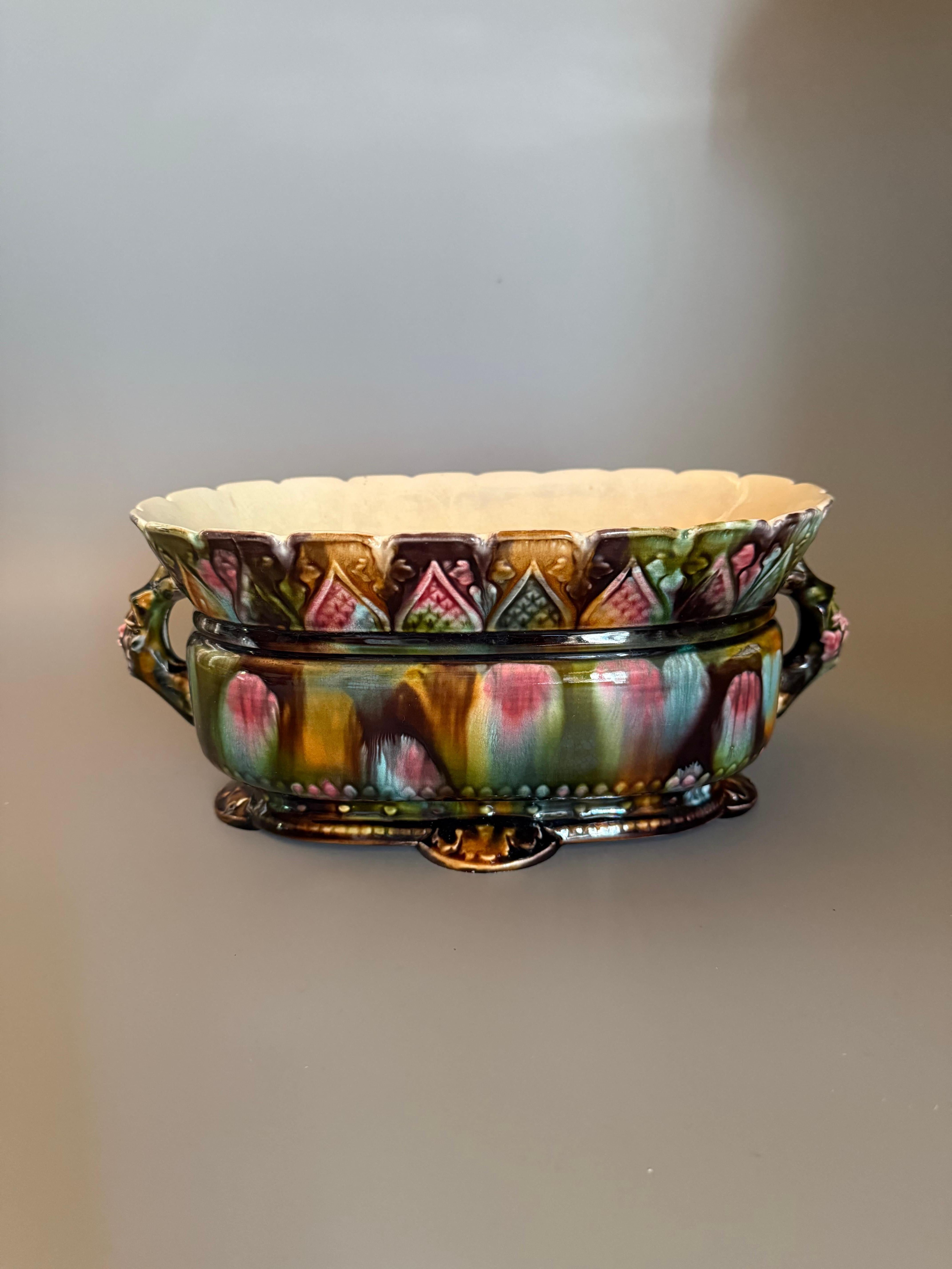 It was produced by the Rörstrand company, one of Sweden's oldest industries, founded in Stockholm in 1726. The bowl is marked with the Rörstrand 3-crown printed mark, which was introduced in 1894.

This piece is an example of Rörstrand's majolica