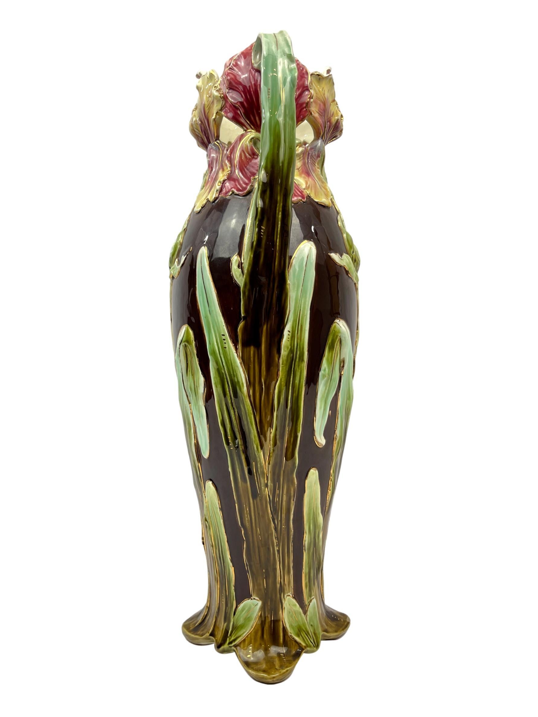 Art Nouveau Majolica large vase, 23-ins., by Sarreguemines, French, ca. 1895, the slender body with relief-molded irises and stalks, on a brown ground.
Book Reference:
Pierre Faveton, 