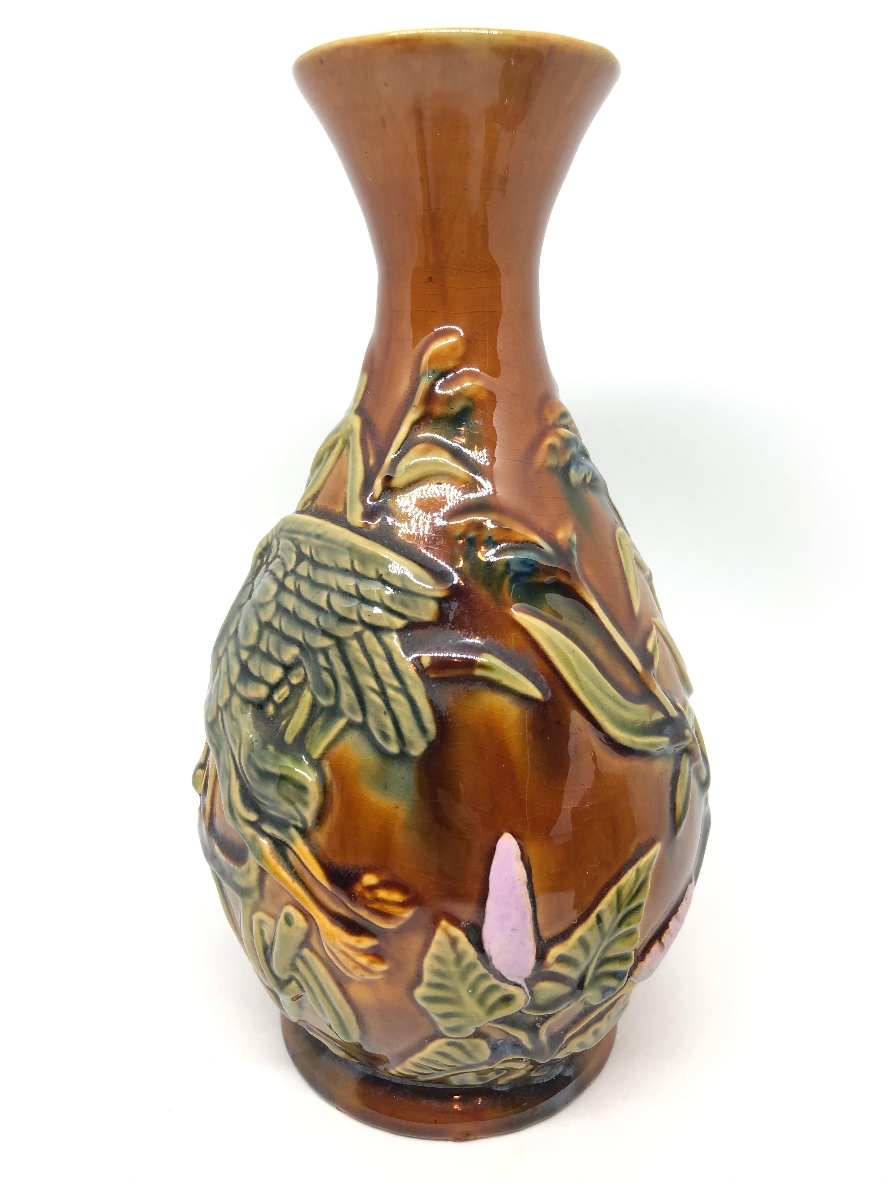 Beautiful majolica vase. A flying Duck motif.  A beautiful piece of art for any room.