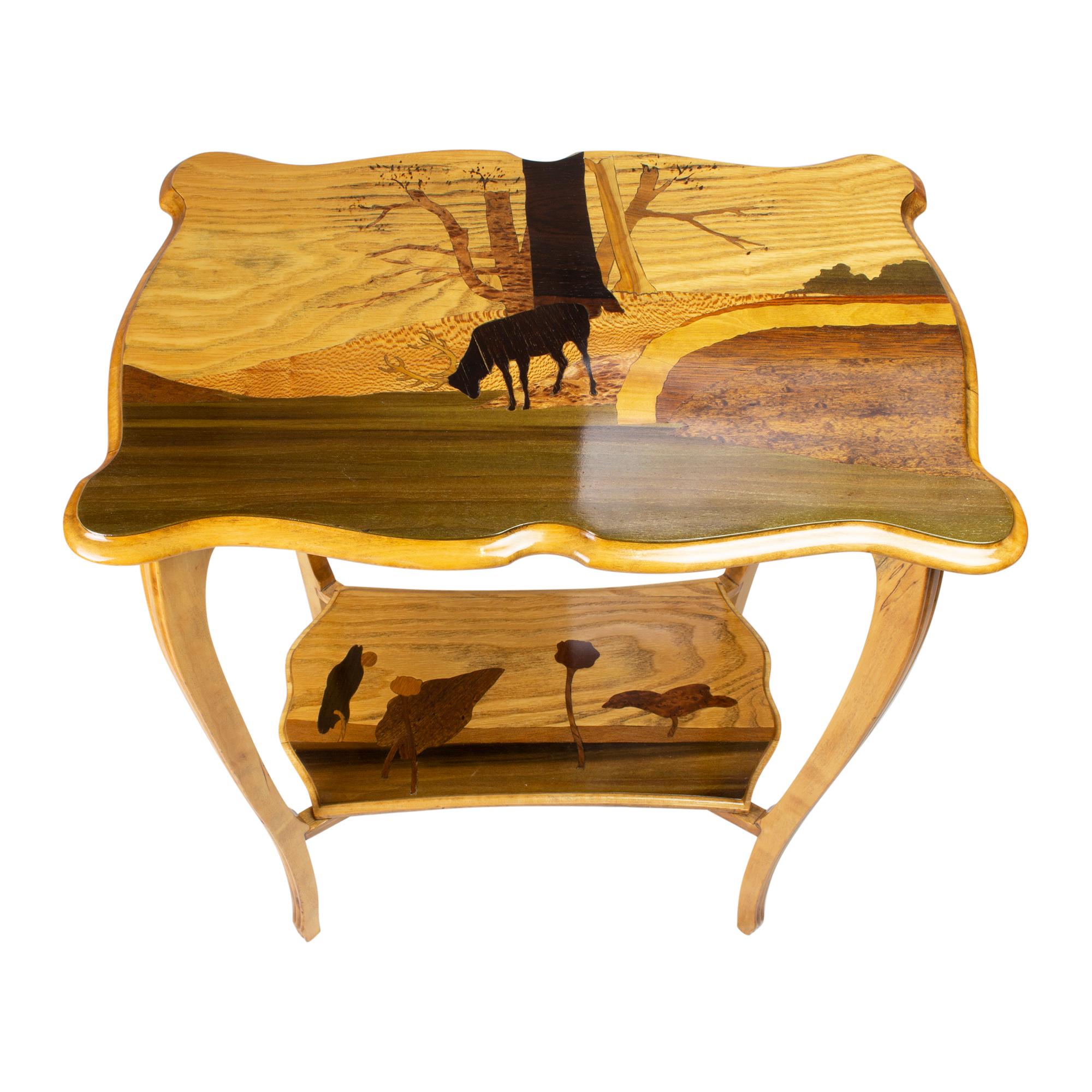 Beautiful Art Nouveau side table from the period, circa 1900 from France. The delicate legs and the plates are made of birch wood. The plates also have very nice marquetry work from various fruit woods. 

This piece is reminiscent of works by