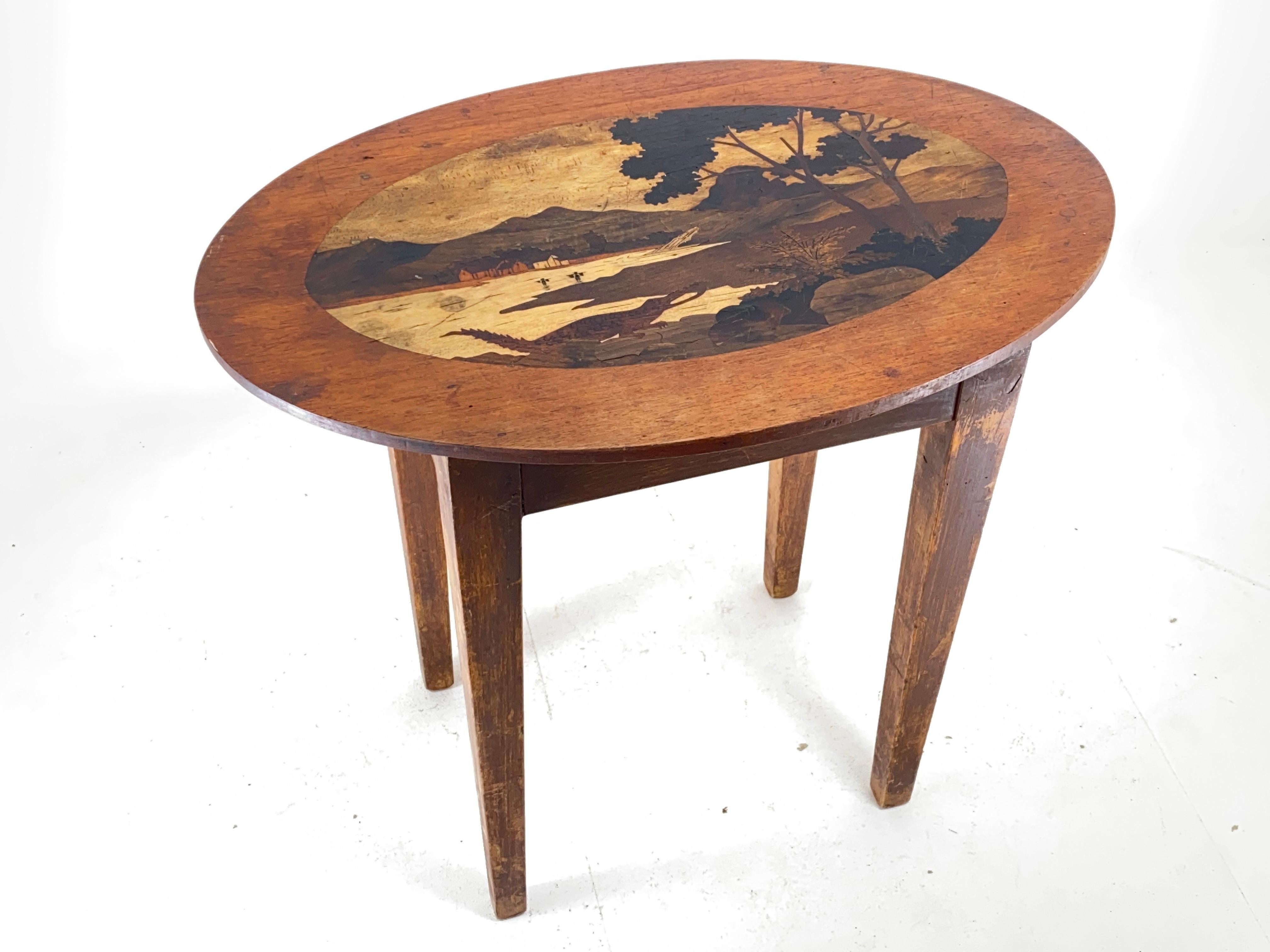 This table is an Art nouveau table, with wood marquetry. It has been done in France circa 1920. It is in brown color.
