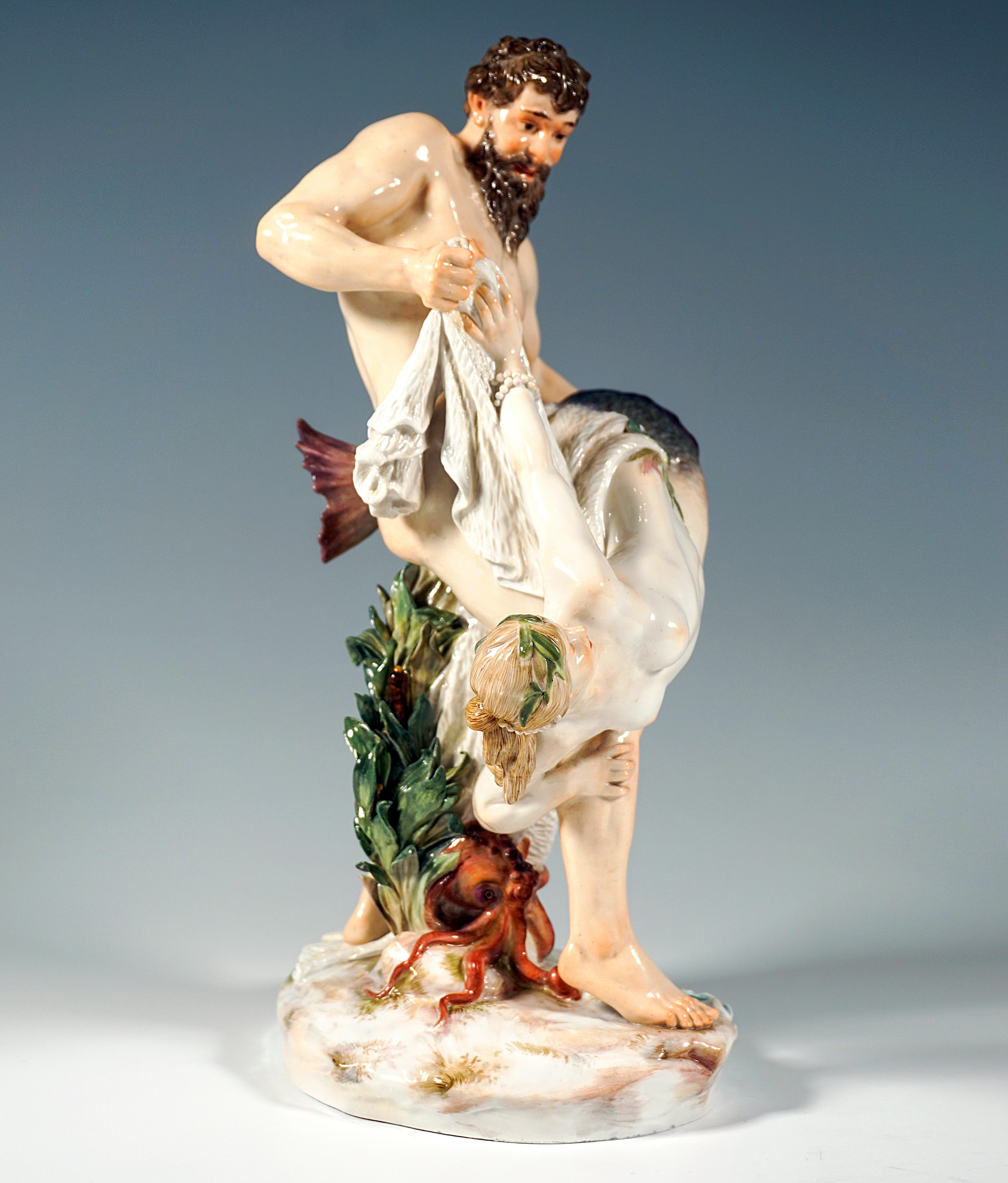 Exquisite Large Meissen Art Nouveau Porcelain Group:
Exceptional, detailed depiction of an unclothed sturdy, fisherman with thick beard, freeing his catch, a beautiful mermaid adorned with pearl ribbons and aquatic plants with two intertwined fins,