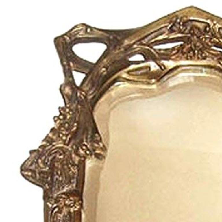 An Art Nouveau easel back frame dressing table mirror.