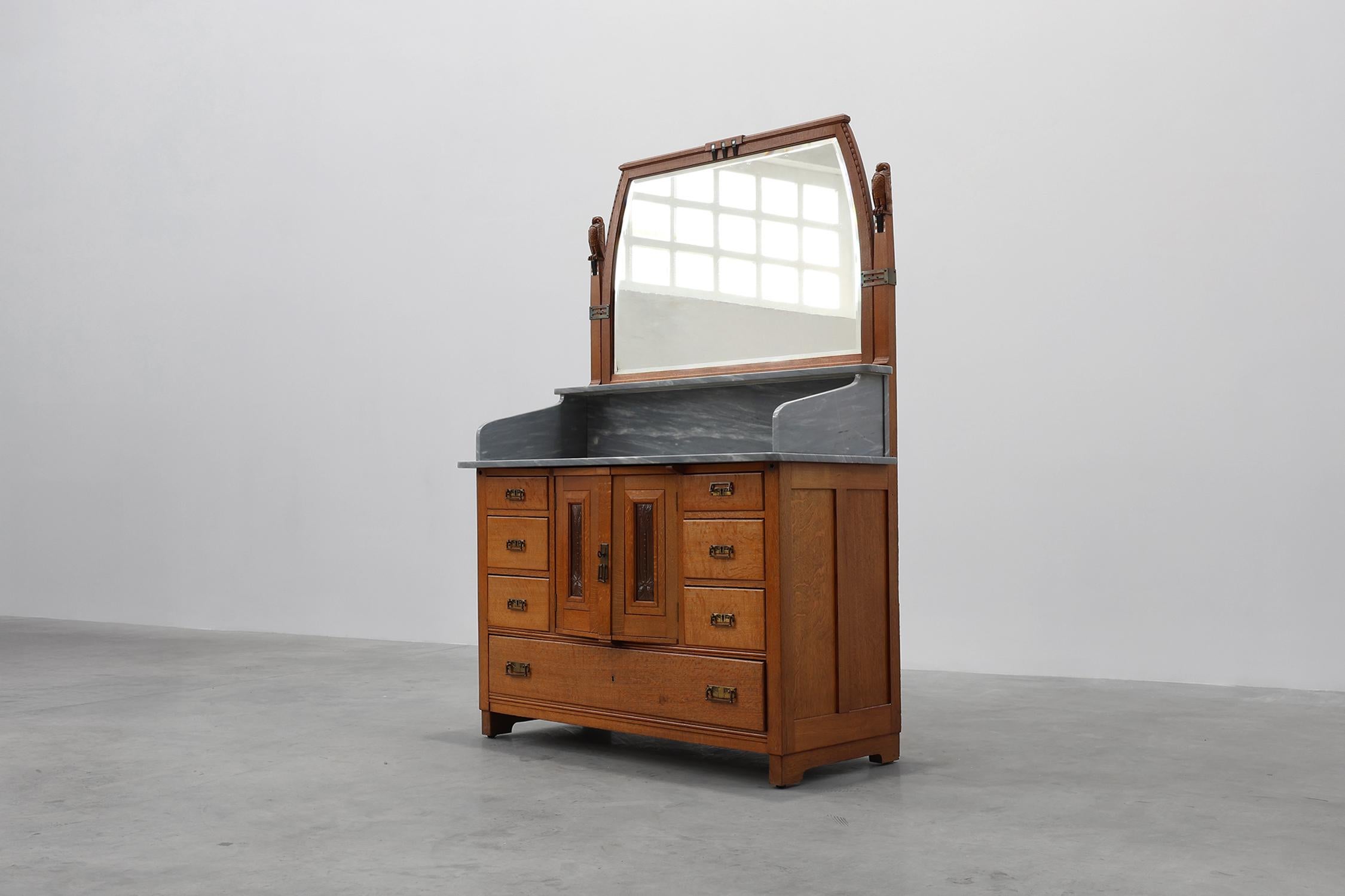 Belgium / 1905 / mirrored sideboard / De Coene / Geo Verbanck / oak, copper, marble / Art Deco / Art Nouveau

An Art Nouveau cabinet, chest of drawers or sideboard with mirror most likely designed by De Coene Kortrijk with artwork by Geo Verbanck, a
