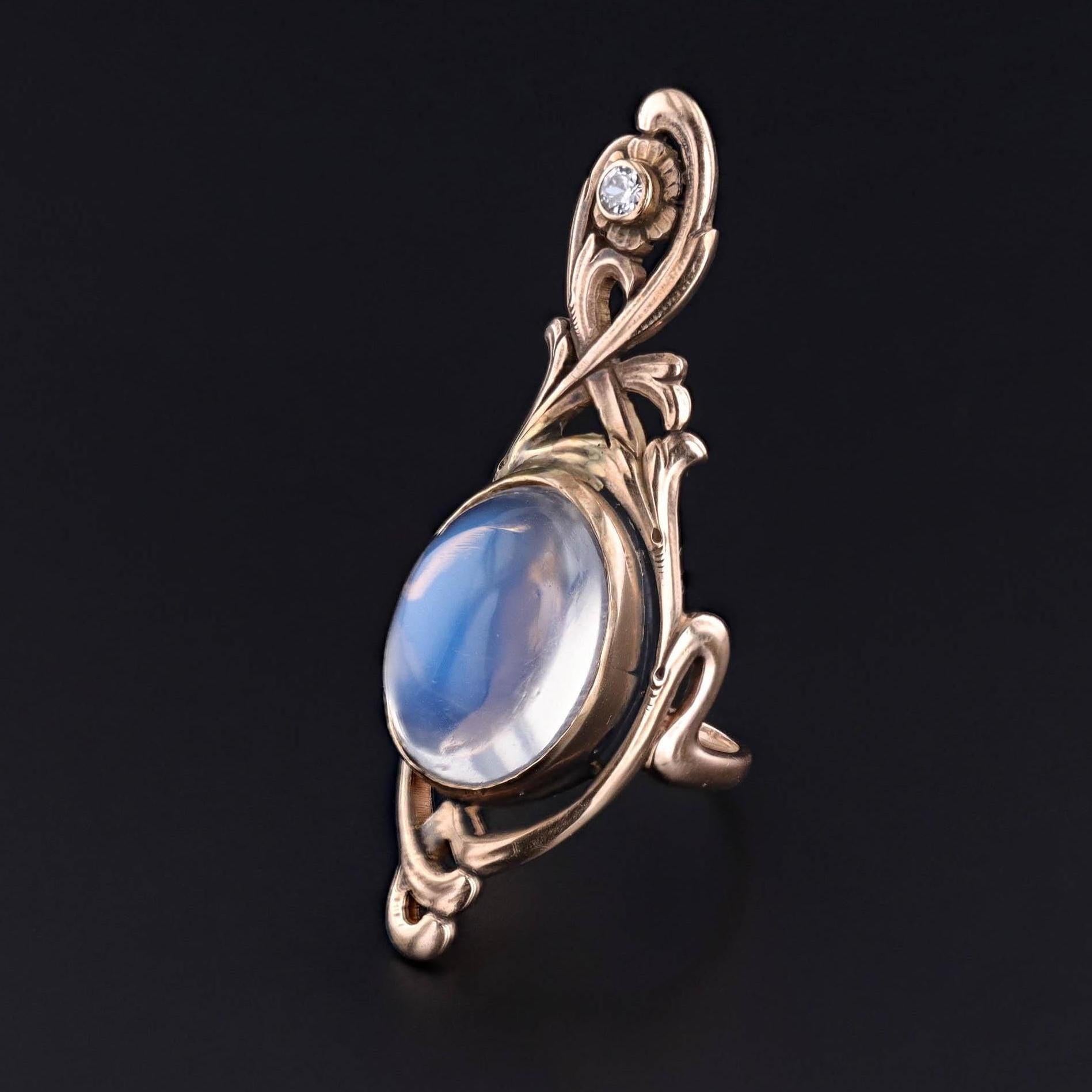 Art Nouveau Moonstone Ring: This antique statement ring (circa 1890) features a 15.14ct moonstone cabochon set in 14k gold with transitional cut diamond accent.

The face of the ring measures 1.9 inches from north to south by 0.6 inches wide, and it