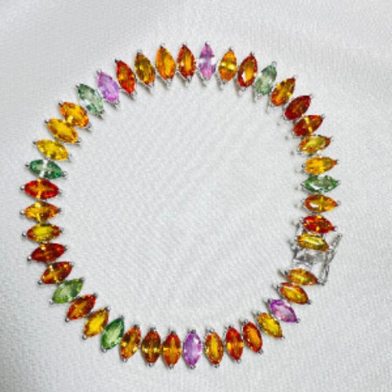Art Nouveau Multi Sapphire Tennis Bracelet for Engagement in sterling silver showcases endlessly sparkling natural multi sapphire, weighing 14.5 carat. It measures 7 inches long in length. 
Multi Sapphire stimulate concentration and reduces stress.