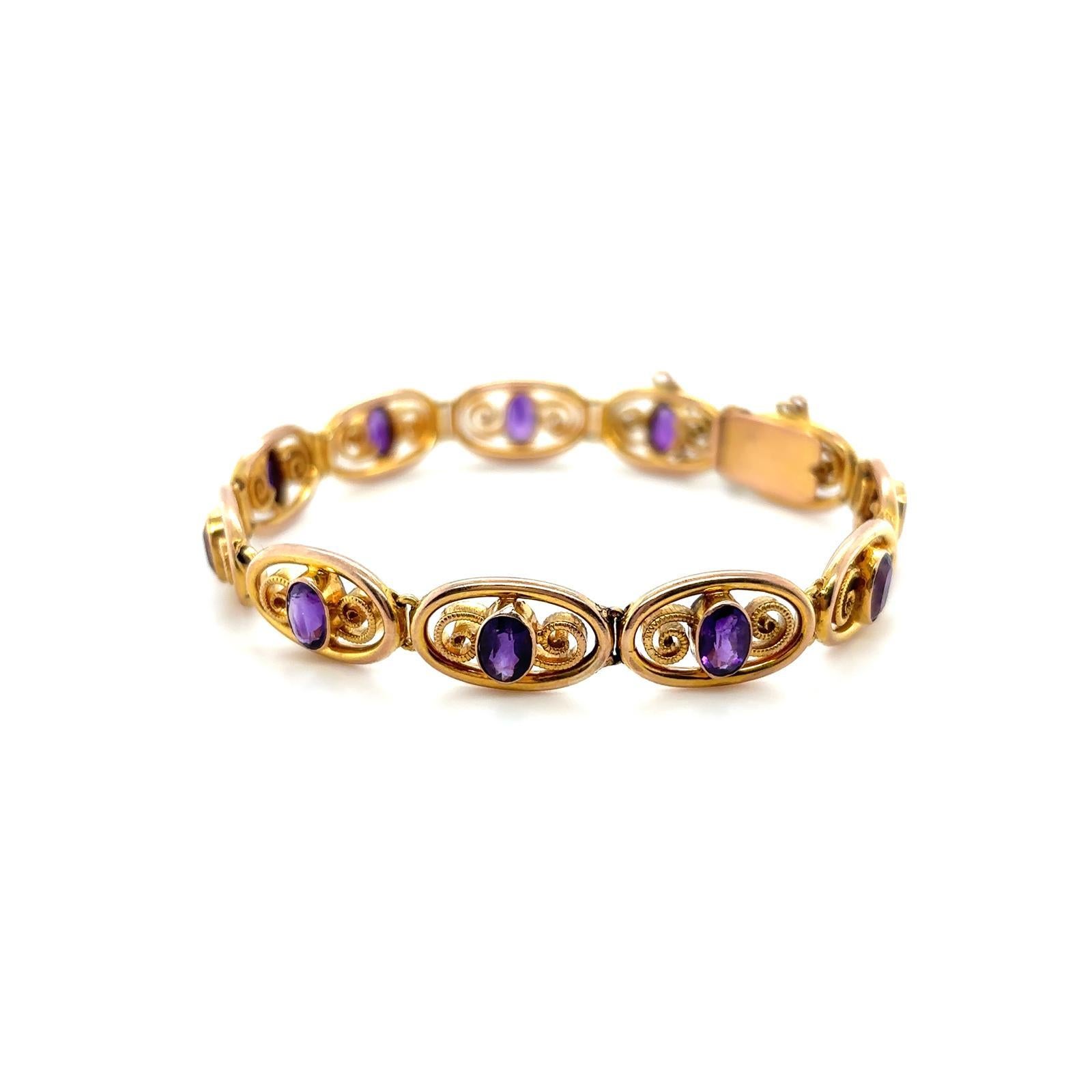 A Murle Bennett Art Nouveau 9 karat yellow gold amethyst bracelet

A finely crafted 9 karat yellow gold bracelet of eleven articulated swirling segments each set to its centre with an oval cut amethyst of deep purple colour, for a total weight of