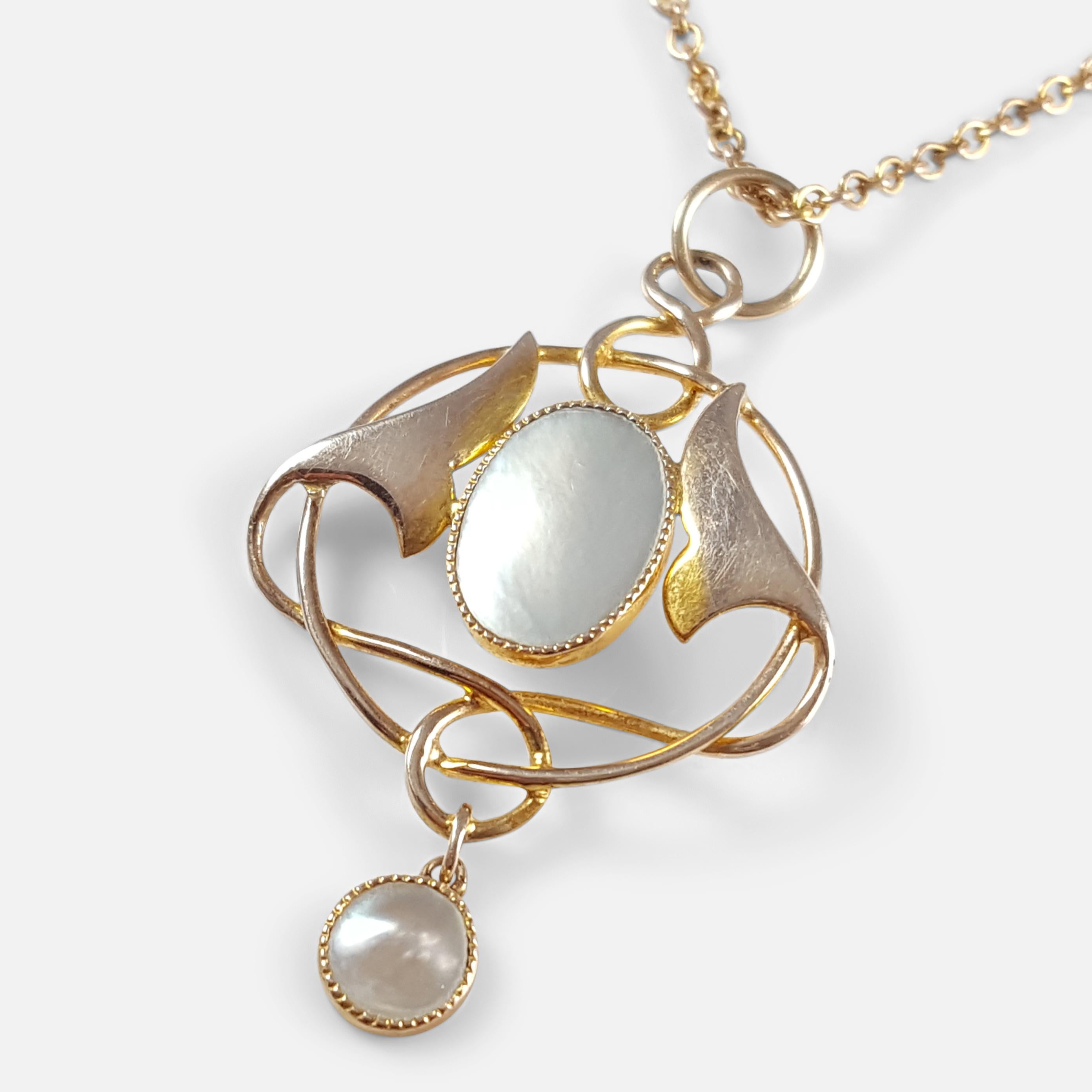 Description: - This is a fine antique Art Nouveau Murrle Bennett & Co Celtic Revival 9 karat yellow gold & blister pearl pendant, circa 1905. The pendant is designed in the celtic revival style. The two blister pearls are in good condition. The