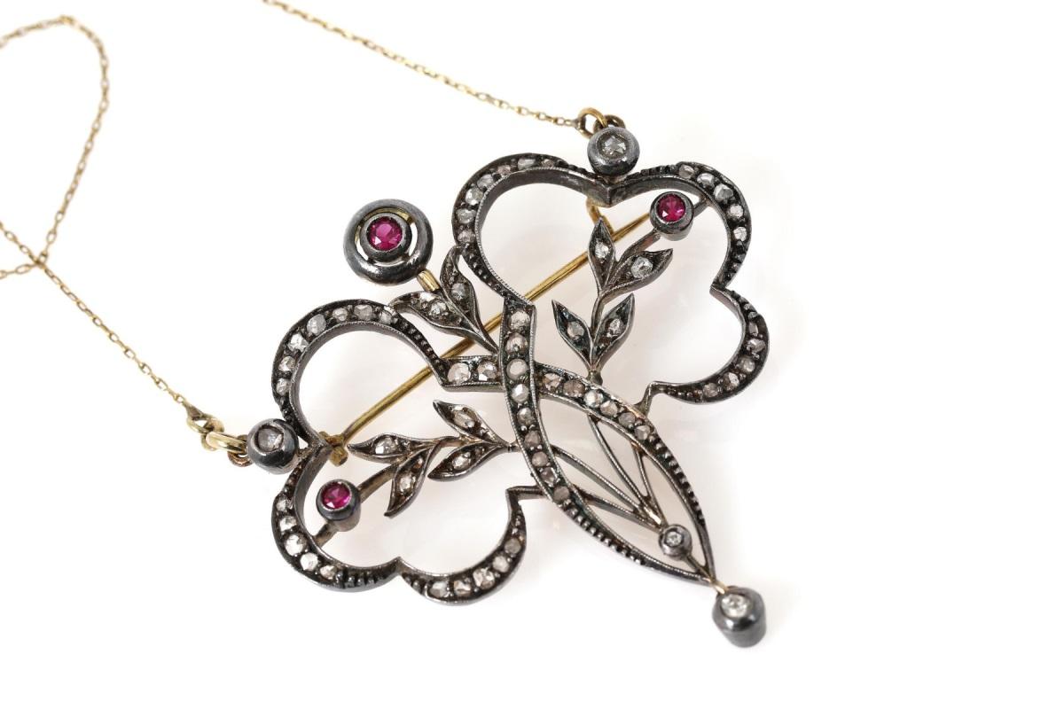 Necklace, old brooch-pendant with rubies and diamonds. Set with three round rubies and numerous old rosette-cut diamonds and one old brilliant-cut diamond.

Origin: Western Europe, early 20th century.

Necklace set in silver and 14-carat