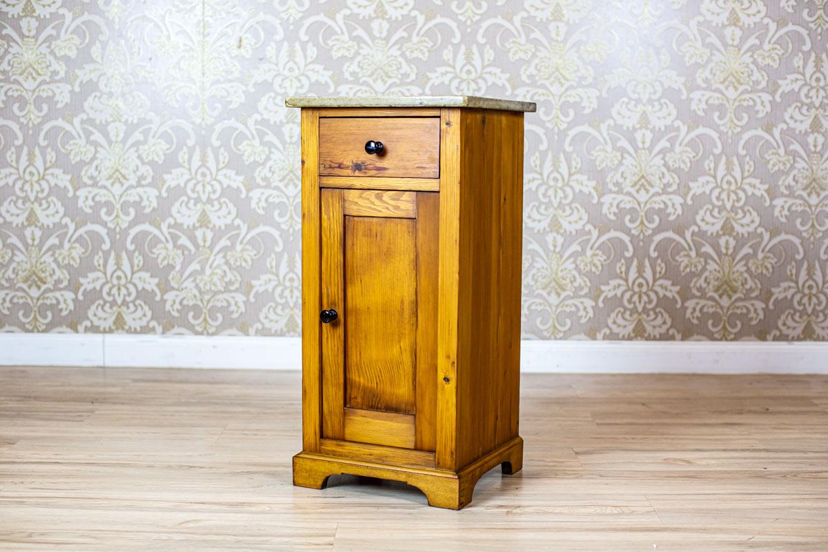 Art Nouveau Pine Nightstand from the Early 20th Century with Stone Top

We present you an Art Nouveau nightstand circa 1910.
This piece of furniture is made of pine and topped with a stone board.
Presented nightstand has undergone renovation and is