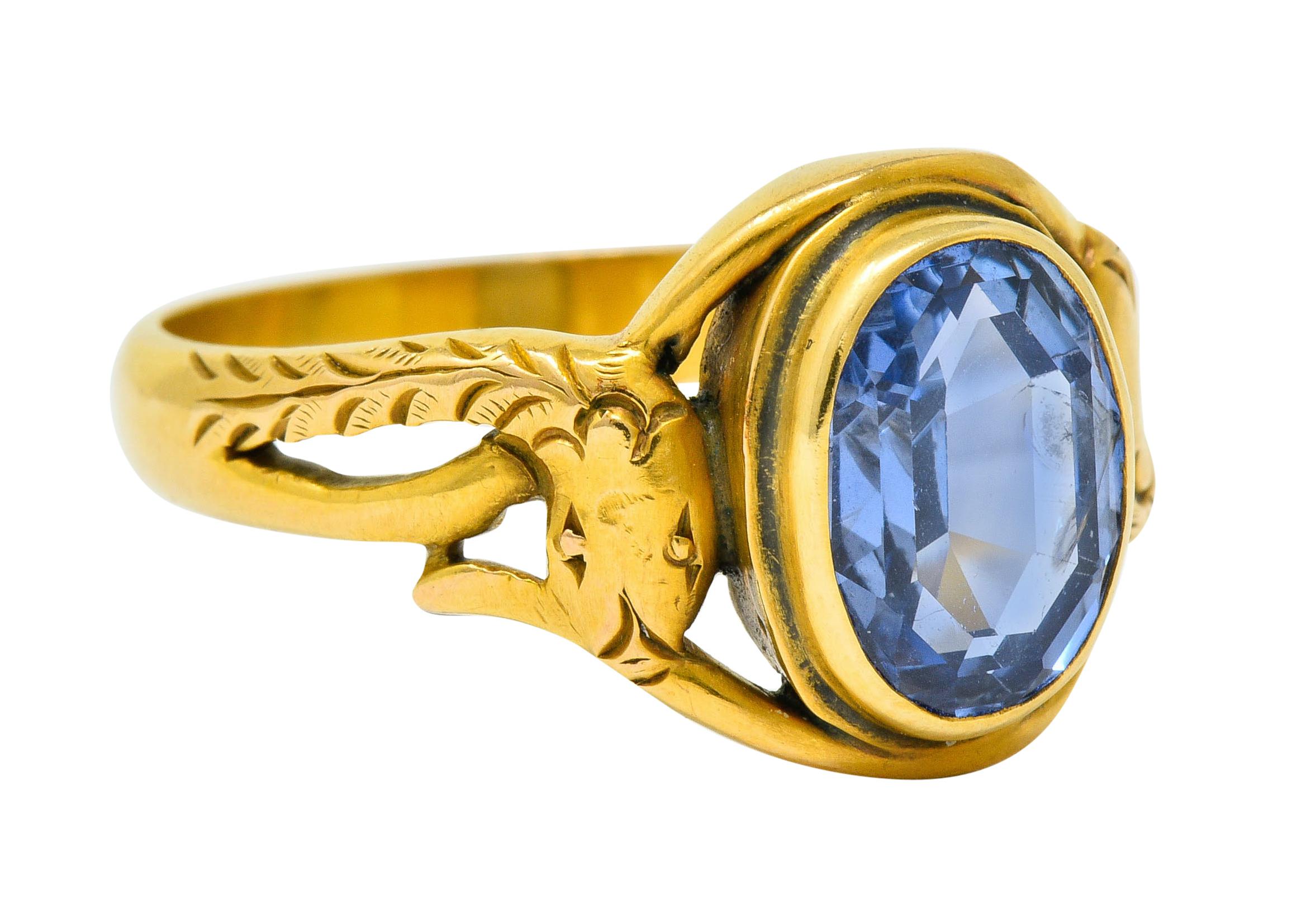 Centering on oval mixed cut Ceylon sapphire with unique octagonal faceting and weighs approximately 3.50 carats

Transparent and light blue in color with no indications of heat; Sri Lankan in origin

Bezel set in a matte gold mounting designed as