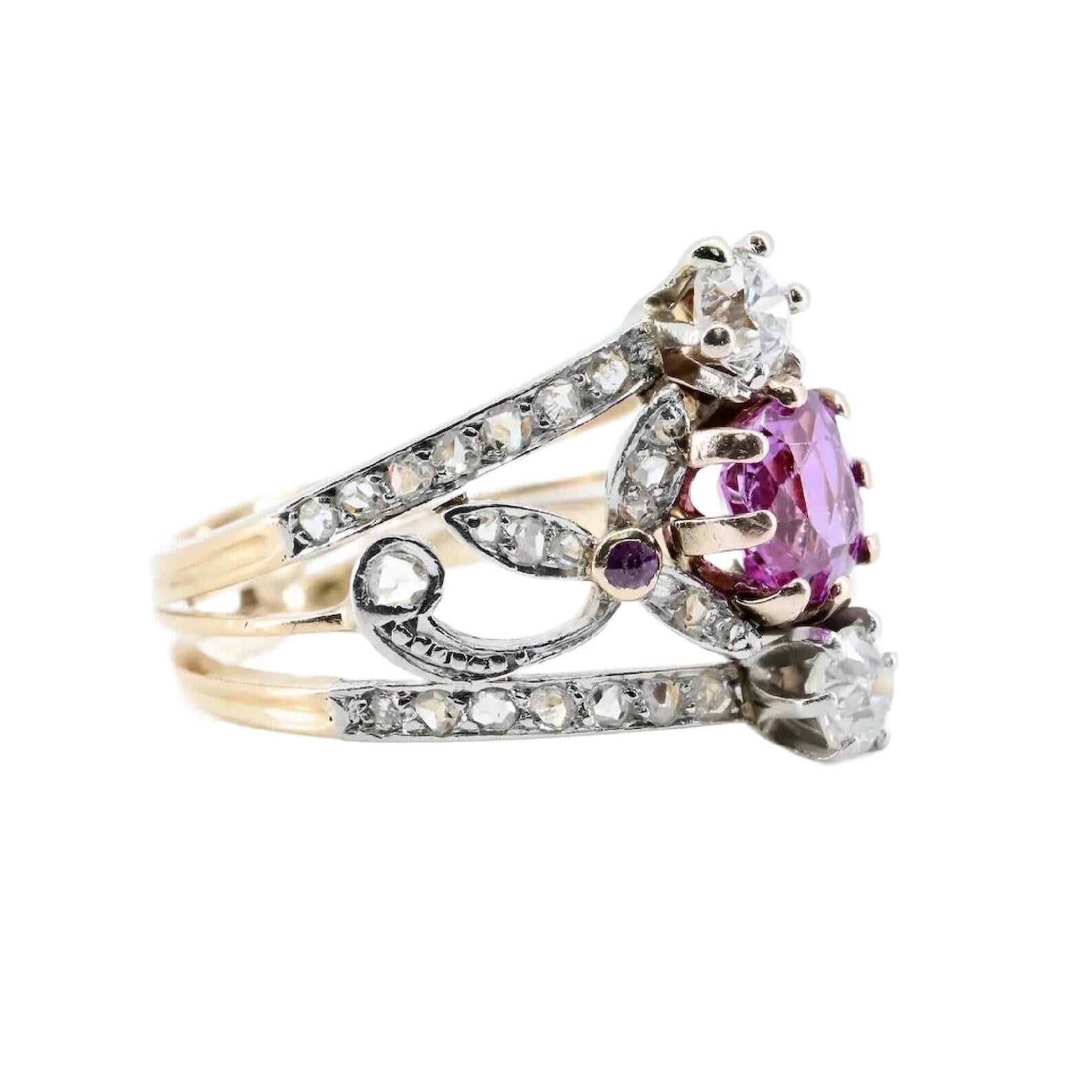 An art nouveau period natural no heat pink sapphire, and diamond ring in platinum topped 18 karat gold.

Centered by a beautiful purplish pink old mine cushion cut sapphire. The sapphire accompanied by a GIA report stating it is Natural, and shows