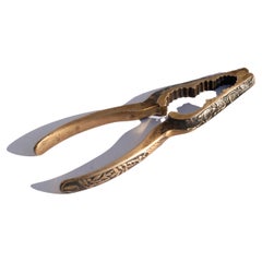 Schiaccianoci Art Nouveau in bronzo e ottone, motivi floreali, fine XIX secolo