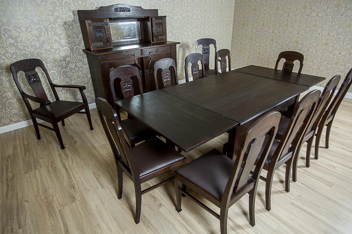 We present you furniture, circa 1910/1920, kept in the Art Nouveau style.
It is made in solid oak wood and soft wood in oak layer.
Presented set is composed of a cupboard, an extendable table, and ten chairs (armchairs visible in the photos are