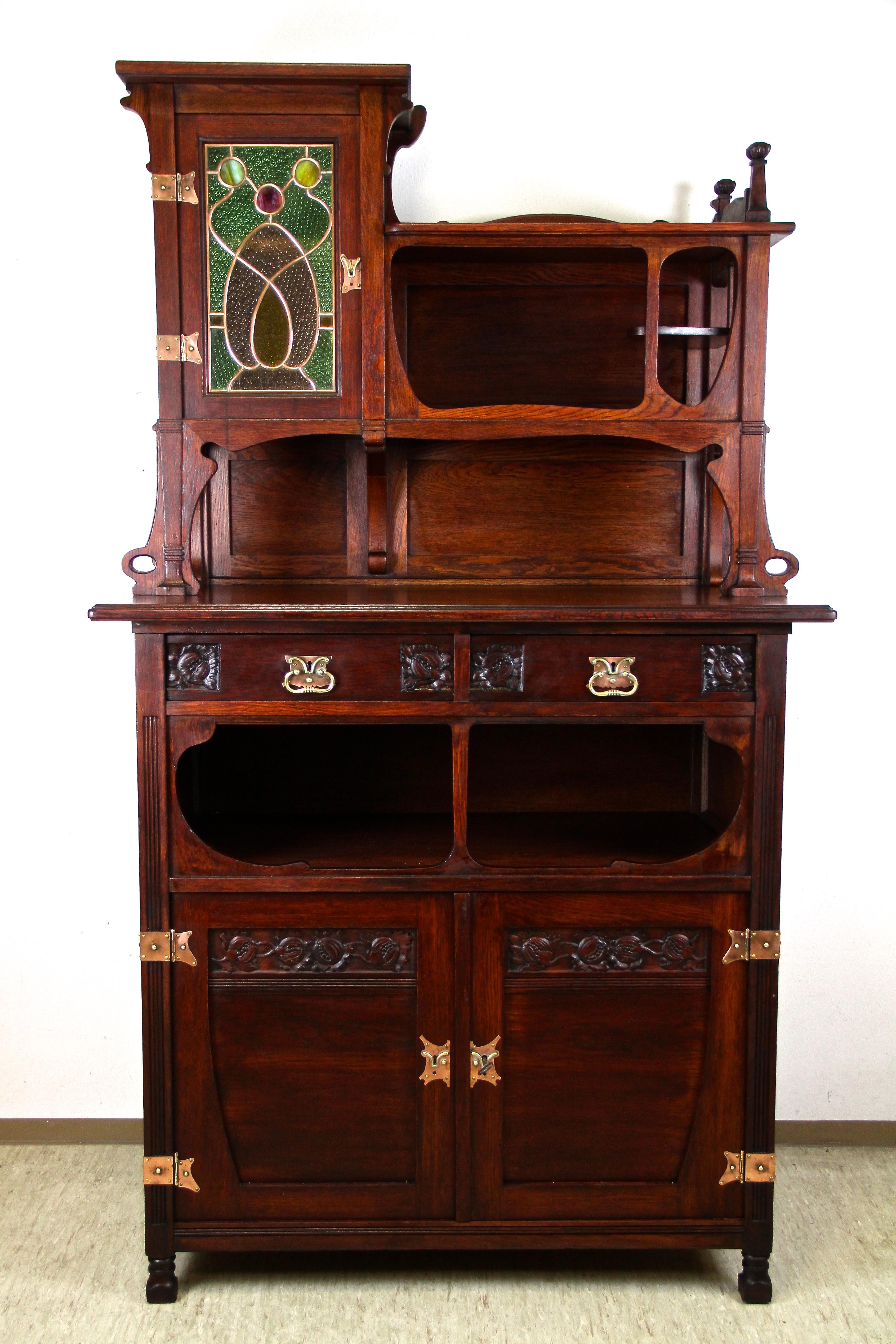 Marvelous Art Nouveau oakwood cabinet/ Buffet originated from the period in Austria around 1900. An exceptional designed buffet made of solid oakwood, reflecting the renown organic design language of the Art Nouveau period at its best. Consisting of