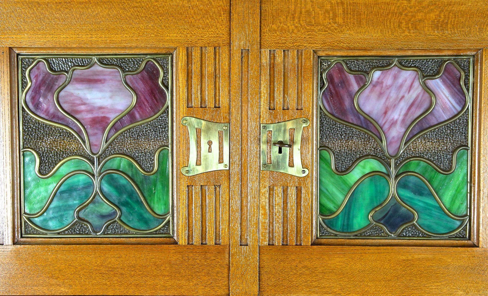 Hand-Carved Art Nouveau Oakwood Cabinet/ Buffet With Tiffany Style Glass Inlays, AT ca 1910 For Sale