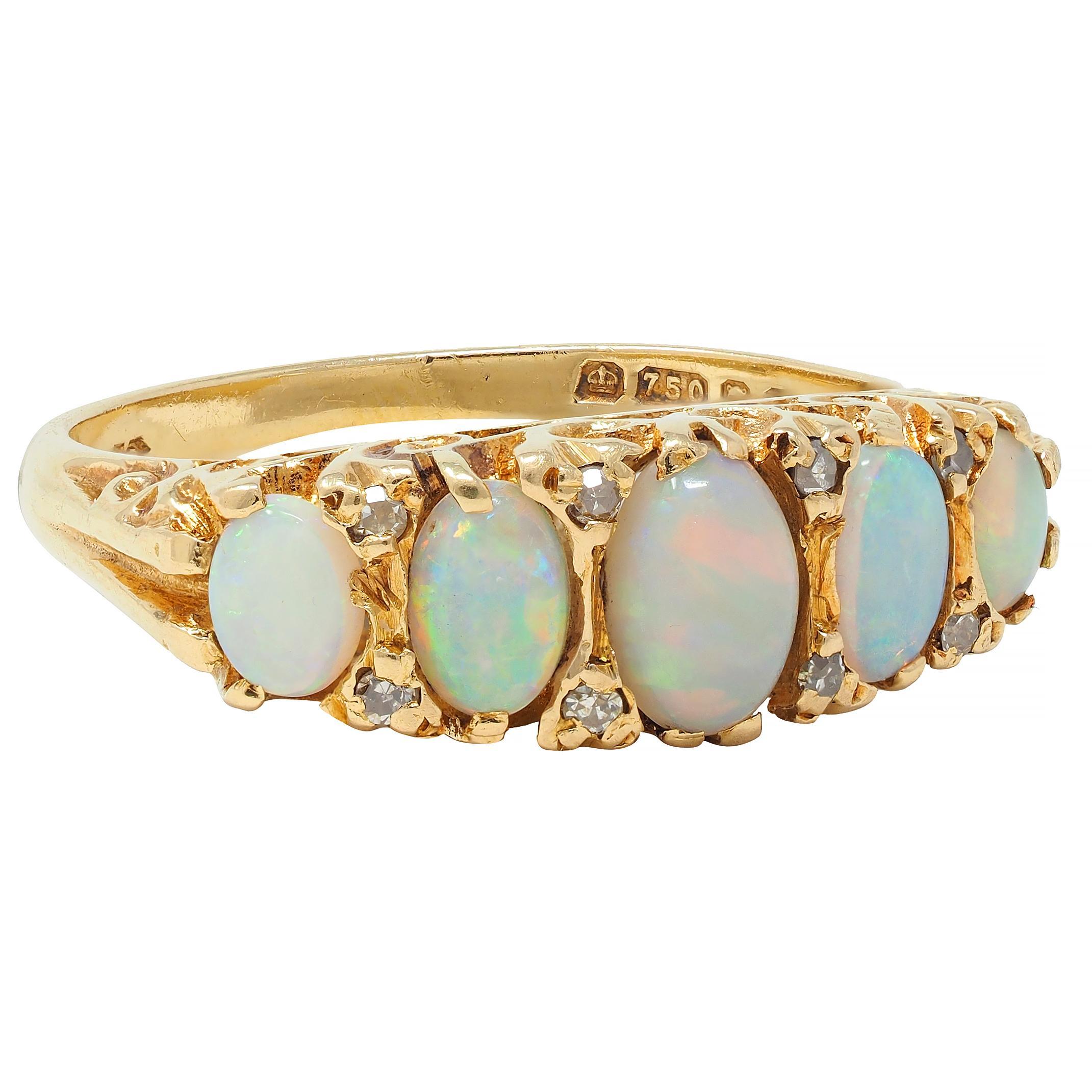 Featuring five graduated opal cabochons prong set east to west 
Oval shaped and ranging in size from 2.5 x 3.0 to 4.0 x 6.0 mm 
Translucent white body color with spectral play-of-color
With rose cut diamonds bead set in between 
Weighing