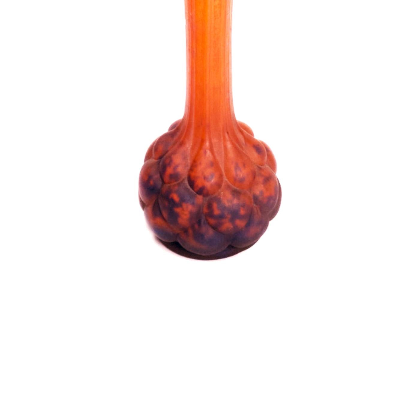Polychrome 'pâté de verre' soliflore-style vase in blue, orange and purple glass with a ball clustered at the bottom and a thin neck. Piece signed with Nancy's «Lorraine» acid.Glass paste is a multi-layered glass on which an image has been etched