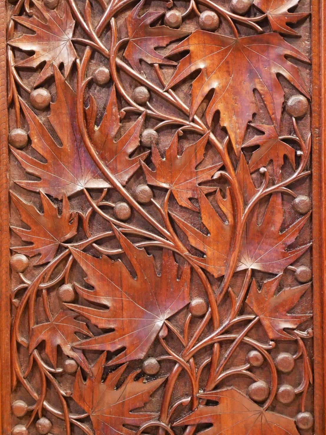 Original Art Nouveau period French paravan, room divider. Four leaves massive exotic wood panels hand carved with floral motives, iris flowers, lotus flowers, water reed, and maple tree.
The screen is carved on both sides with the same pattern.