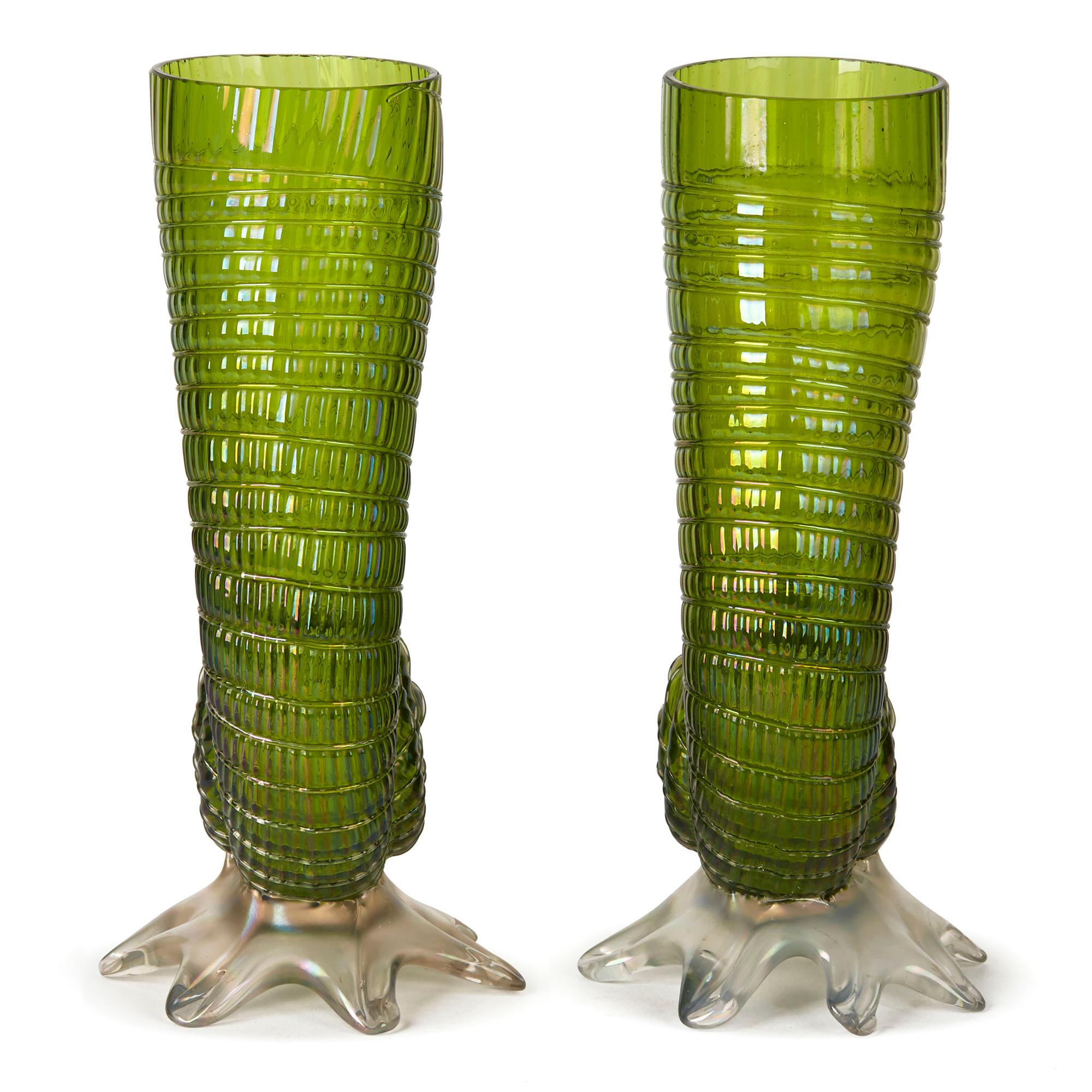 A stunning and rare pair Art Nouveau shell or urchin shaped cornucopia art glass vases decorated with a golden iridescent finish over a green coloured glass body and raised on an iridescent foot. The shell shape is one of the most sought after
