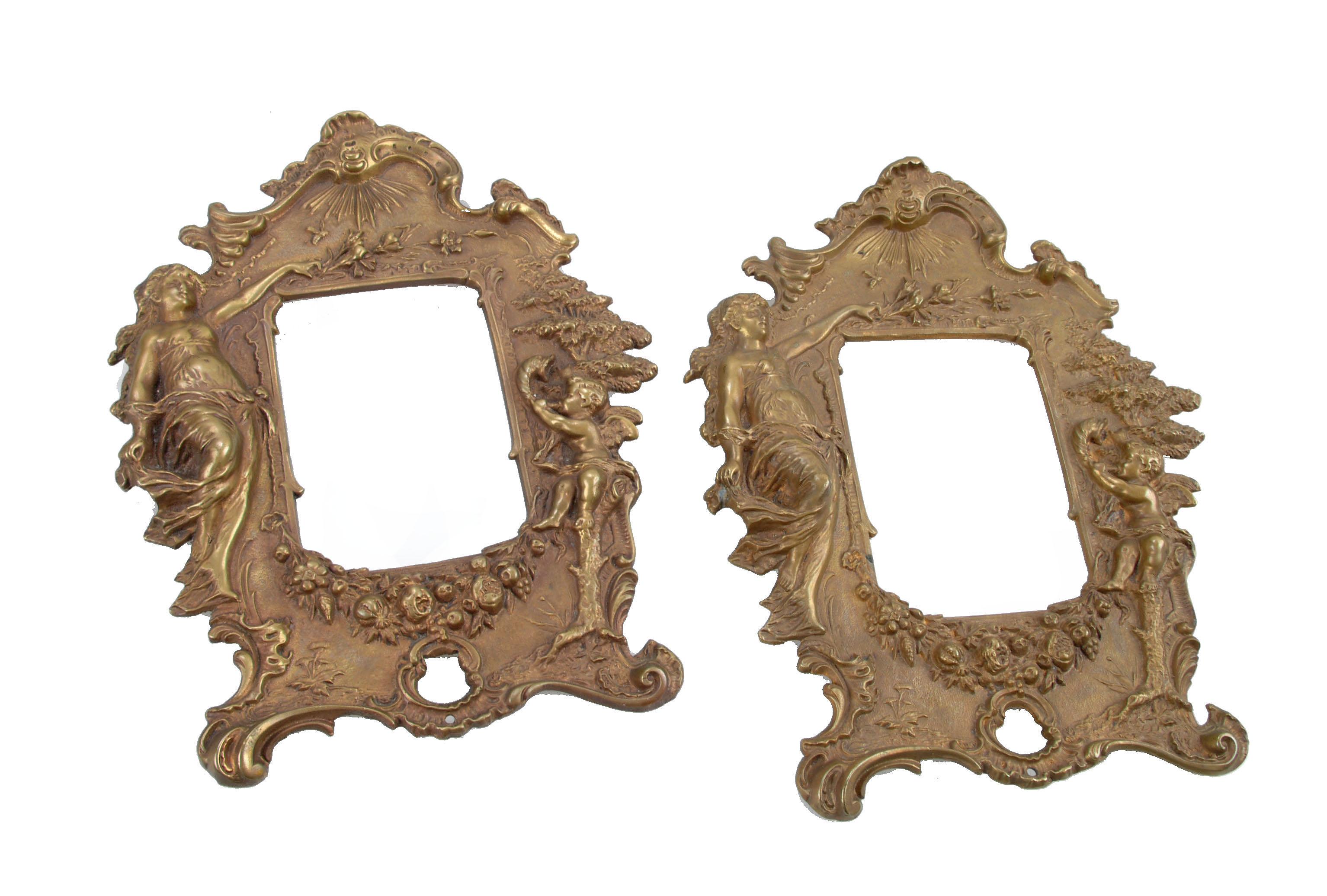 Pair of 1950s Art Nouveau bronze picture frames with angel motifs. 
Each holds an image up to 3.5 inches W x 5 inches H.