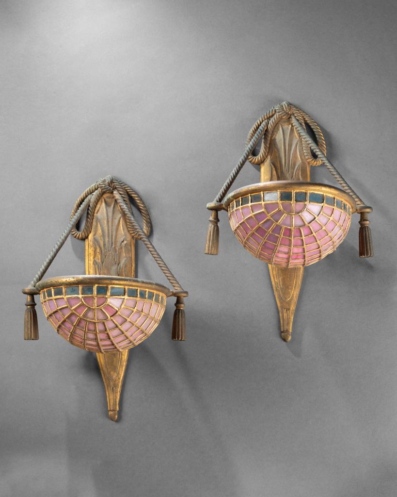 Art nouveau style pair of gilt bronze sconces and art colored glass for the shades

Dimensions 

Height = 34 cm
Width = 20 cm 
Depth = 25 cm

Circa 1910/20, France

Good conditions