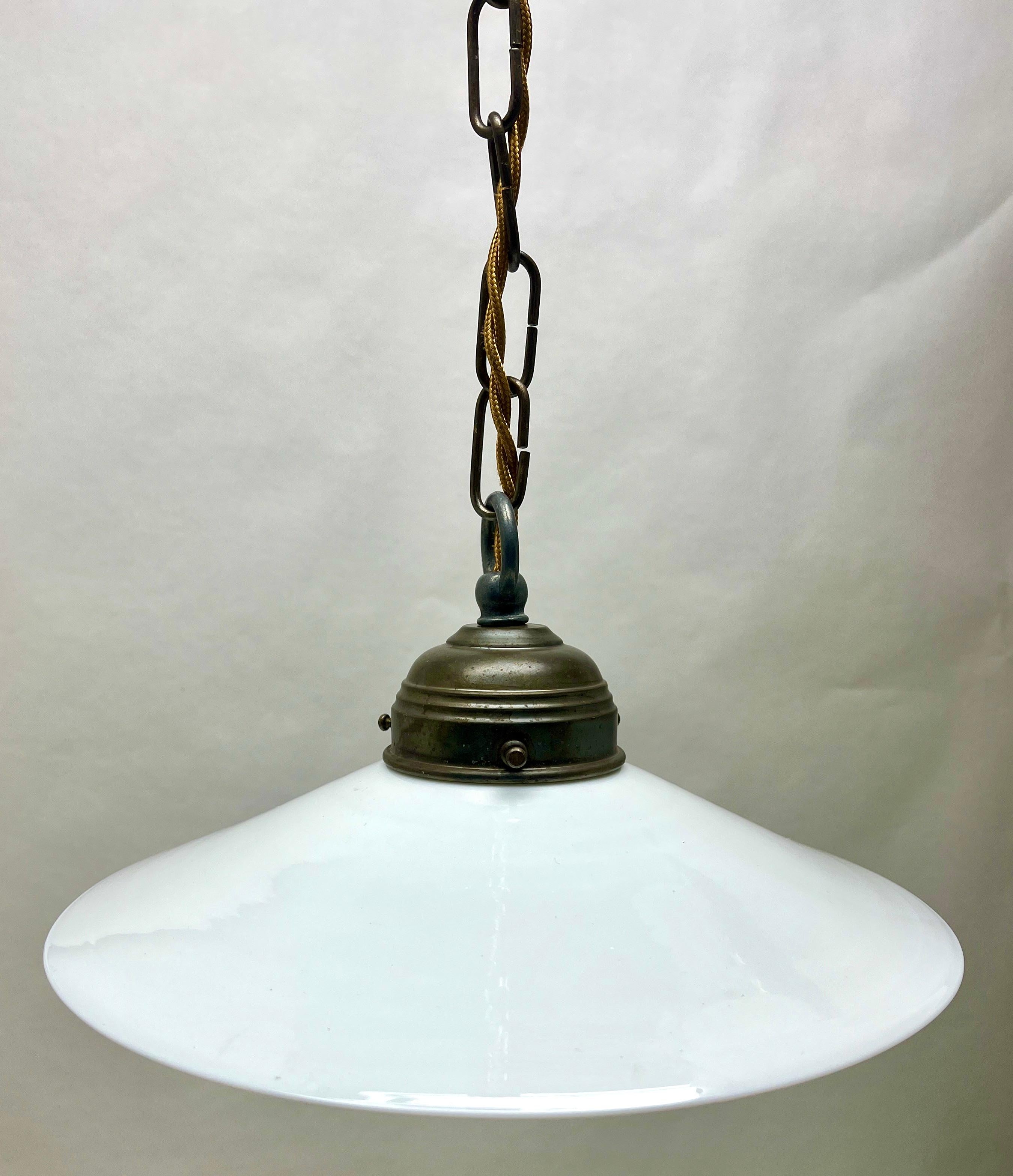 Art Nouveau ceiling lamp.
Photography fails to capture the simple elegant illumination provided by this lamp.

Fitting messing pendant ceiling light with screw fixing to hold a stylish Belgian Art Deco lampshade. 
Good distribution of darker and