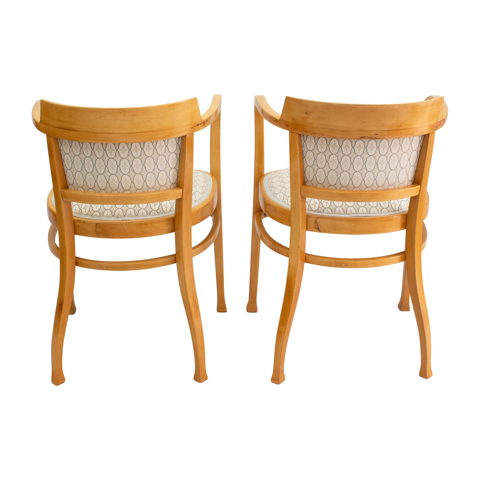 Beautiful pair of Thonet armchairs from the Art Nouveau period in solid beech wood. The chairs are reupholstered and covered with new fabric. In very good restored condition.