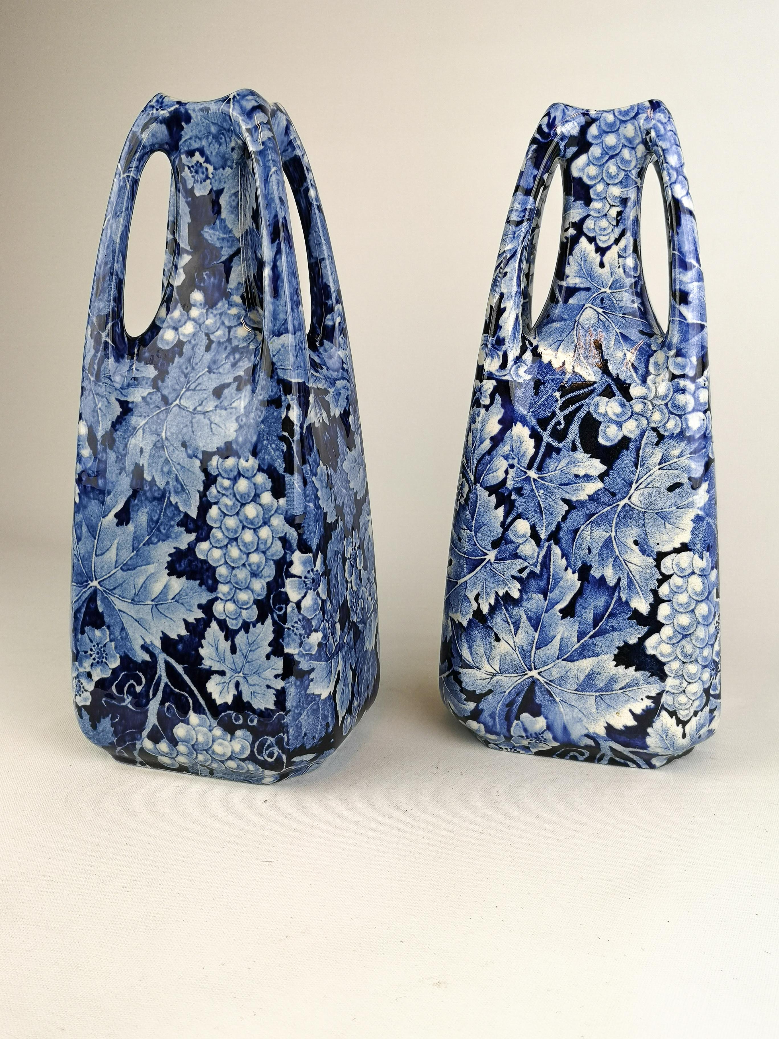 These vases are from the early 1900s and where produced by Rörstrand in Sweden. The name of the vases is Druva and translates to Grape which is exactly what the vases are decorated with.

They are both in very good condition considering the age.