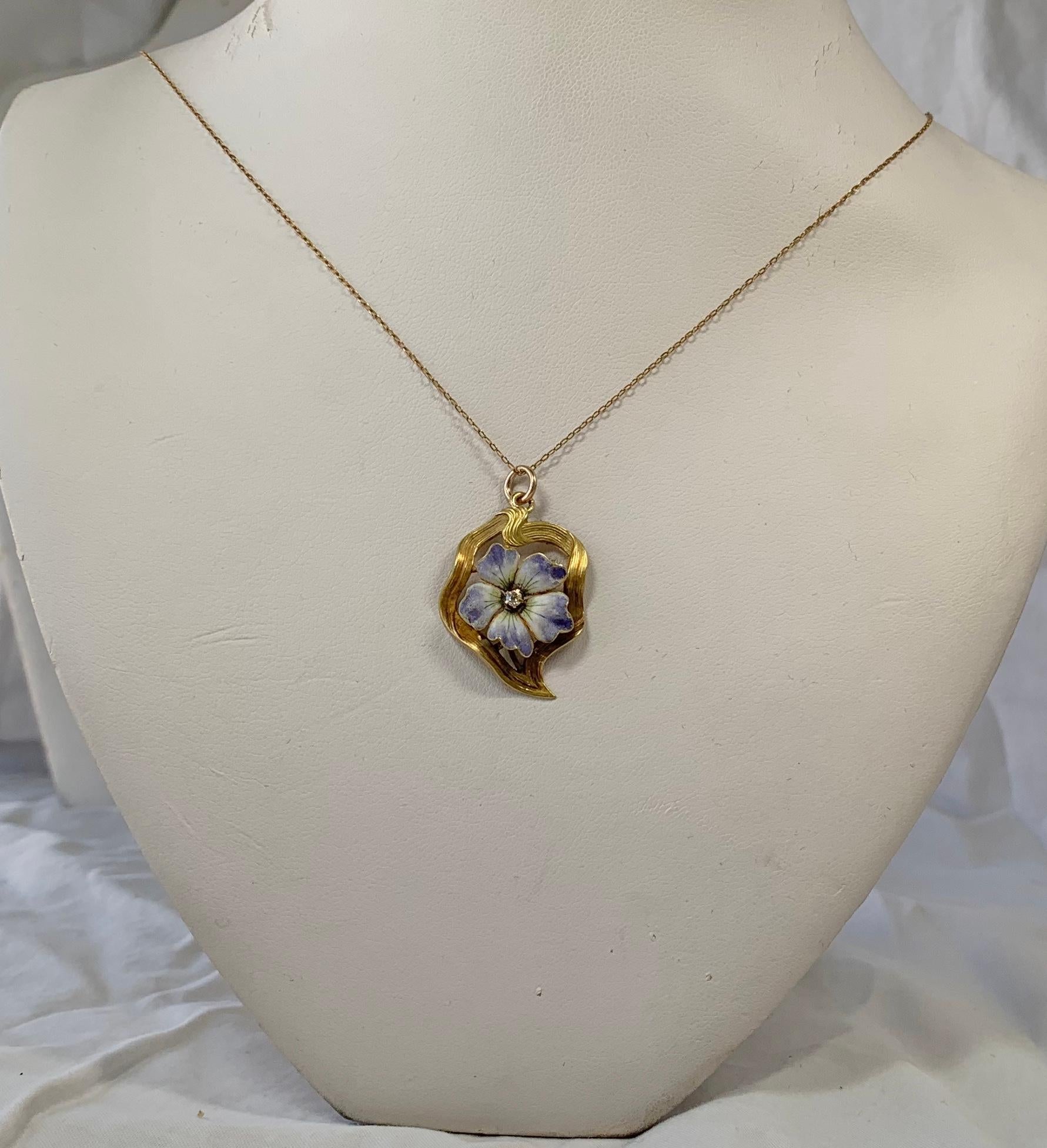 THIS IS A GORGEOUS VICTORIAN - ART NOUVEAU PENDANT NECKLACE WITH A BEAUTIFUL LAVENDER, CREAM AND BLUE ENAMEL FORGET-ME-NOT, OR PANSY FLOWER WITH AN OLD MINE CUT DIAMOND IN THE CENTER.  THE FLOWER IS SET IN AN ELEGANT GOLD RIBBON SURROUND WITH LOVELY