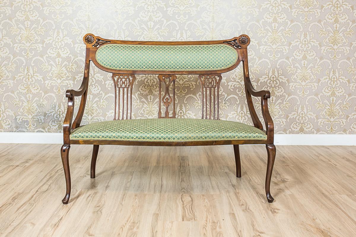 We present you this set composed of a two-seat sofa, and two armchairs.
The whole is kept in the Art Nouveau stylistics.
The seats are upholstered. The backrests with an openwork slat with cut-outs that supports the upholstered section. 
The