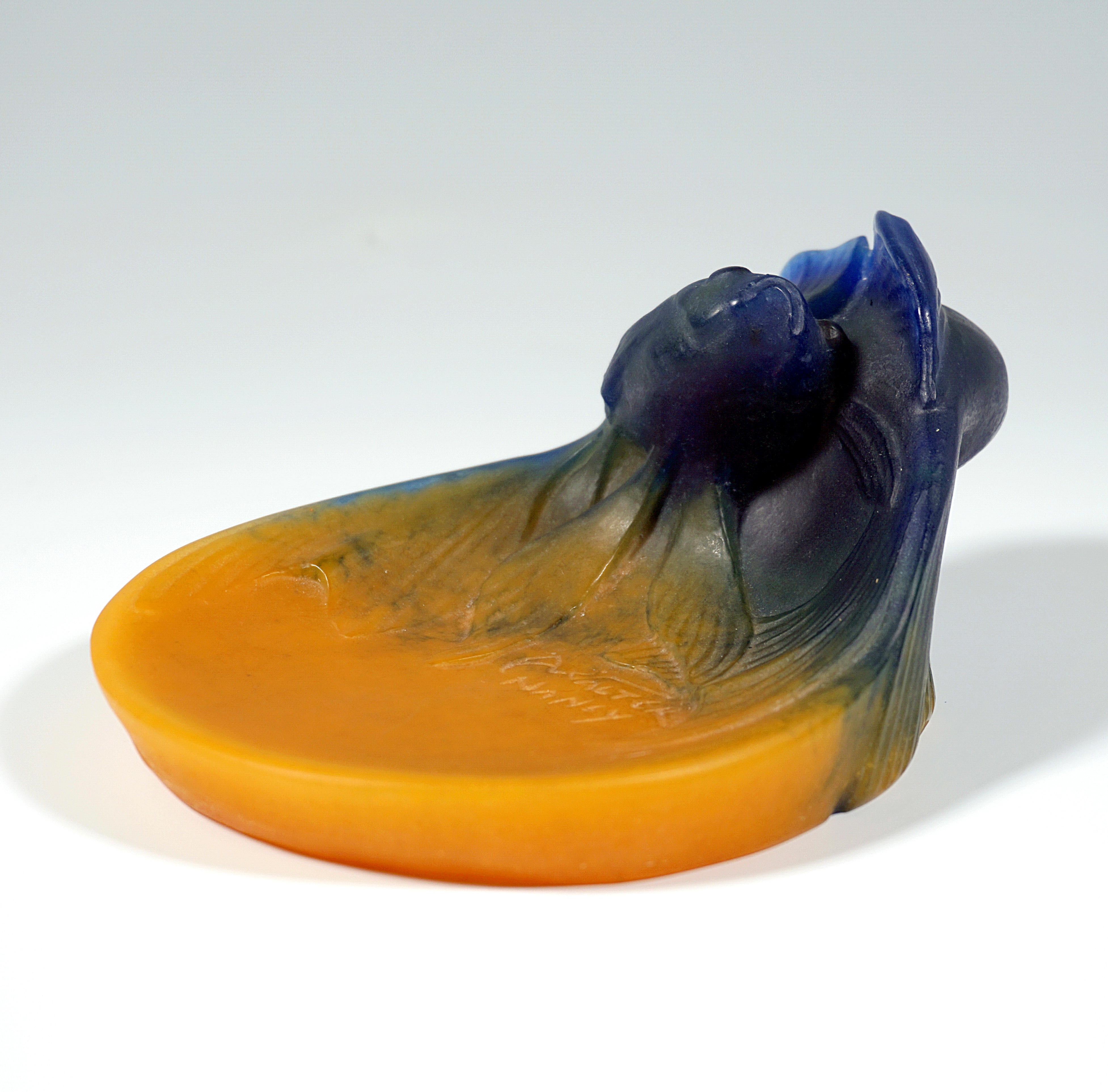 Decorative pâte-de-verre vide-poche: bowl in yolk yellow, one side overflowing in dark blue, swimming around each other, plastically formed goldfish couple.
Signed 'AWALTER NANCY' on the top.

Manufactory: Amalric Walter, Nancy, Lorraine,