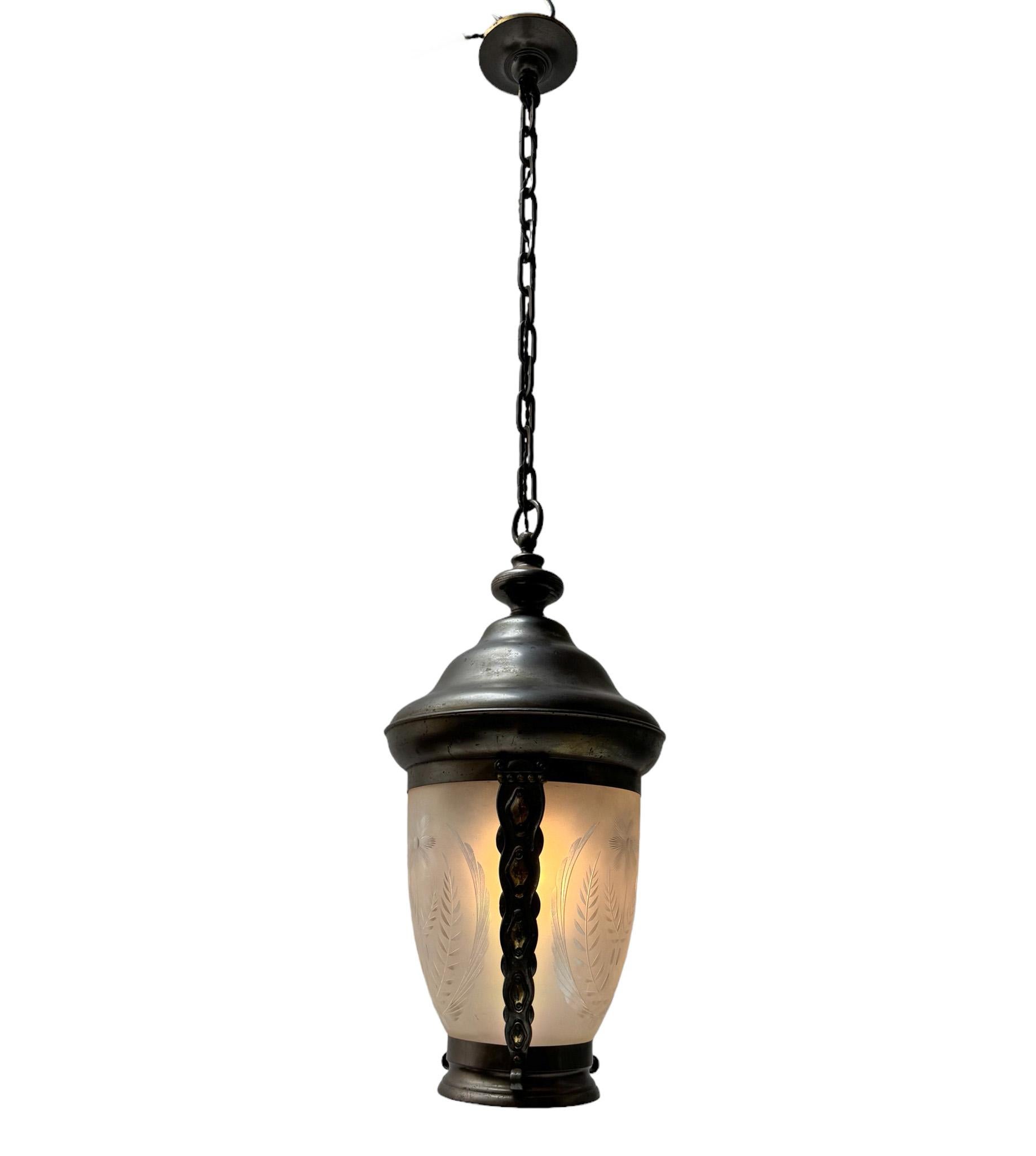 Stunning and rare Art Nouveau hall lantern.
Striking Dutch design from the 1900s.
Original patinated brass frame with original etched glass shade.
Rewired with one original socket for E-27 light bulb.
This wonderful Art Nouveau hall lantern is in