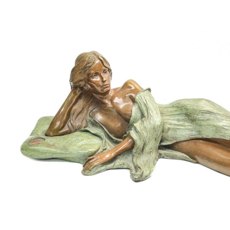 Art Nouveau Patinated Bronze Sculpture of a Beauty, Ltd Ed 31, Signed. 1988

Art Nouveau patinated bronze sculpture of a Beauty, 1988. The sculpture depicts a partially nude beauty lounging in green garbs. Artist signed towards the elbow- we are