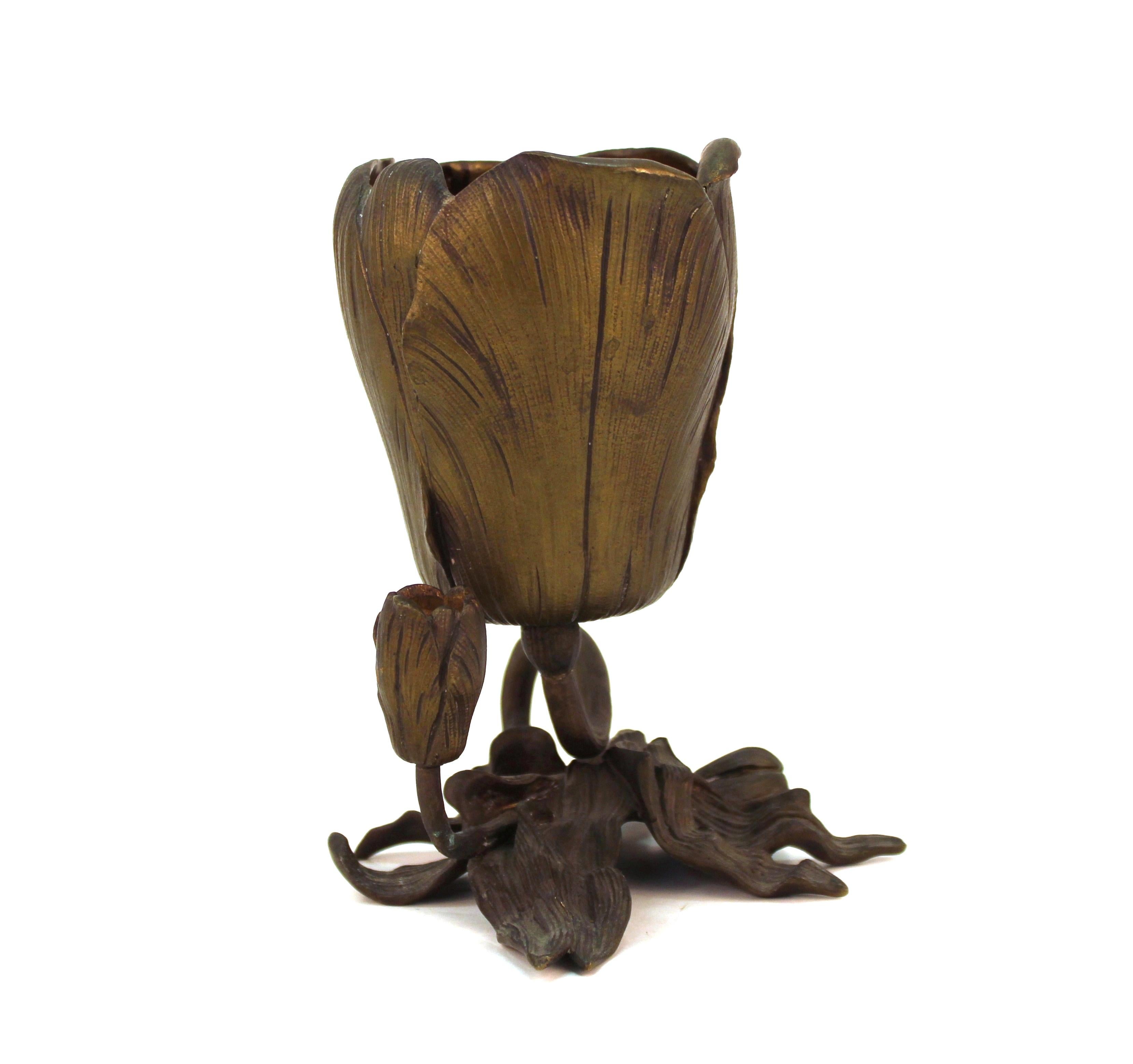 Art Nouveau brown-patinated bronze tulip shaped vase, on a base formed of curving stem, buds and leaves. The piece was likely made during the early 20th century. There is some minor patination loss at the contact points of the bottom.