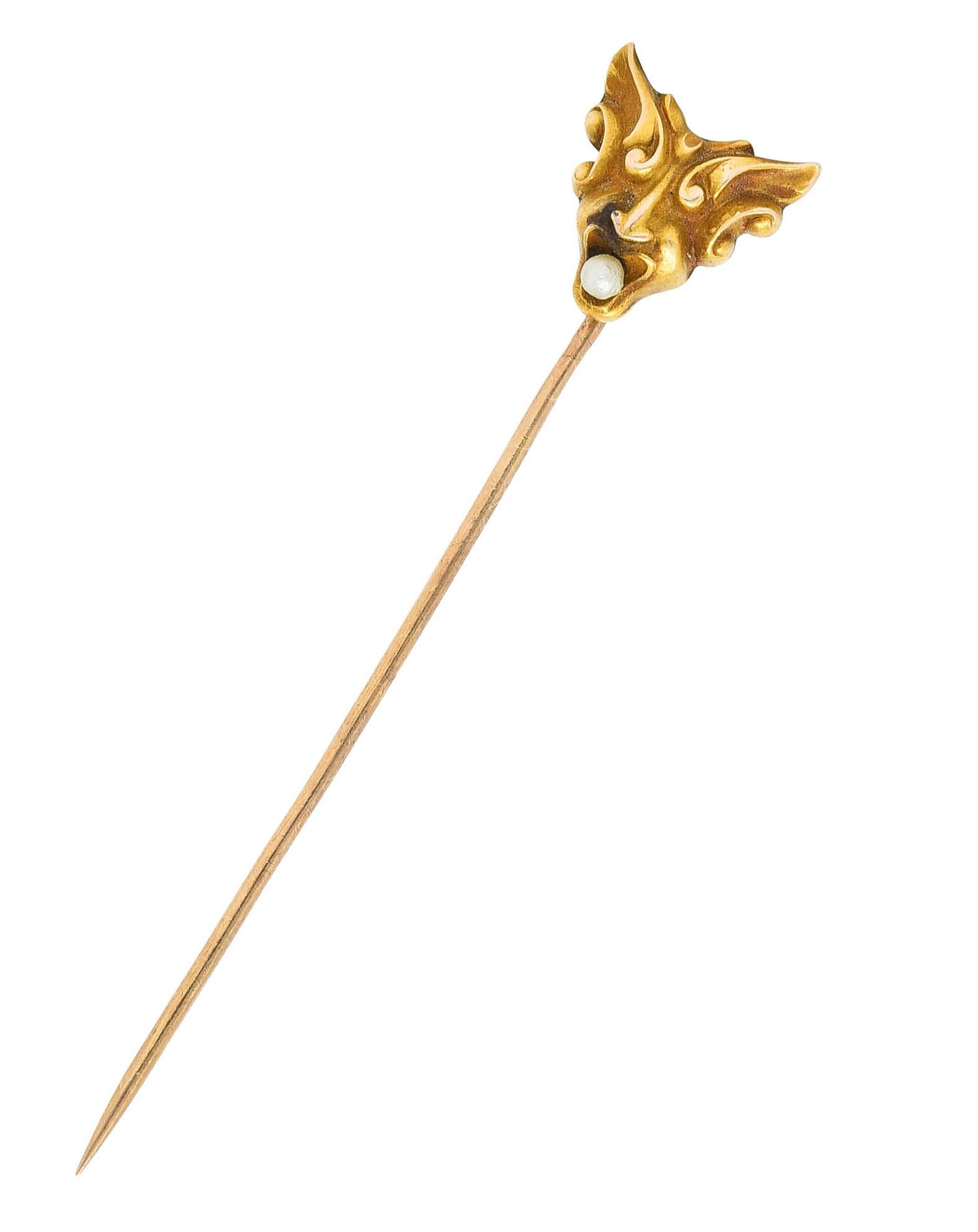 Stickpin designed as stylized winged head of Hermes - messenger of the gods

With whiplash style wings and 2.0 mm pearl in mouth 

Pearl is white in body color with good luster

Head: 1/2 x 1/2 inch

Total length: 2 1/2 inches

Total weight: 1.3