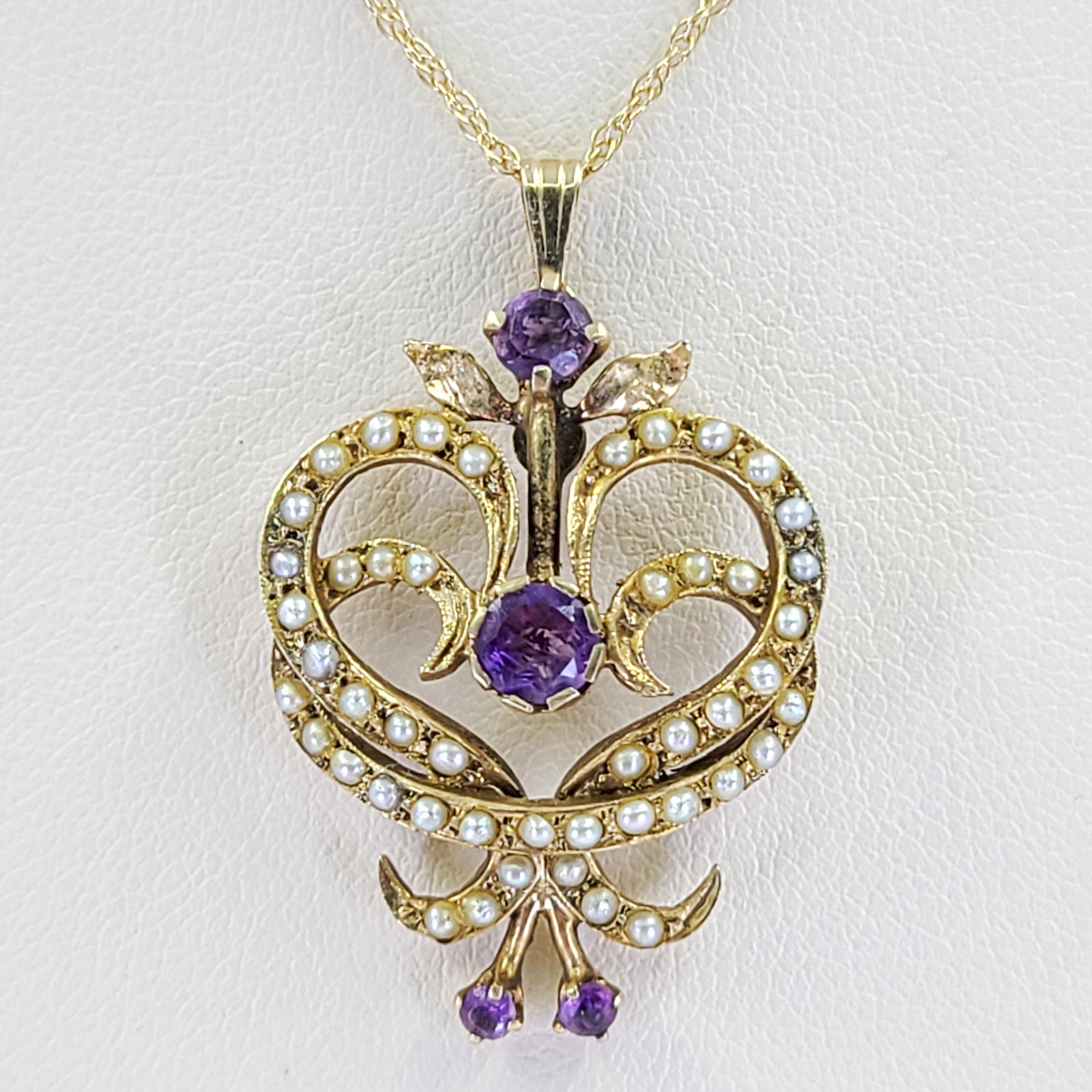 14 Karat Yellow Gold Art Nouveau Pendant Necklace Featuring Seed Pearls and 4 Round Amethysts. 18 Inch Chain With 1.5 Inch Pendant. Finished Weight Is 3.3 Grams.