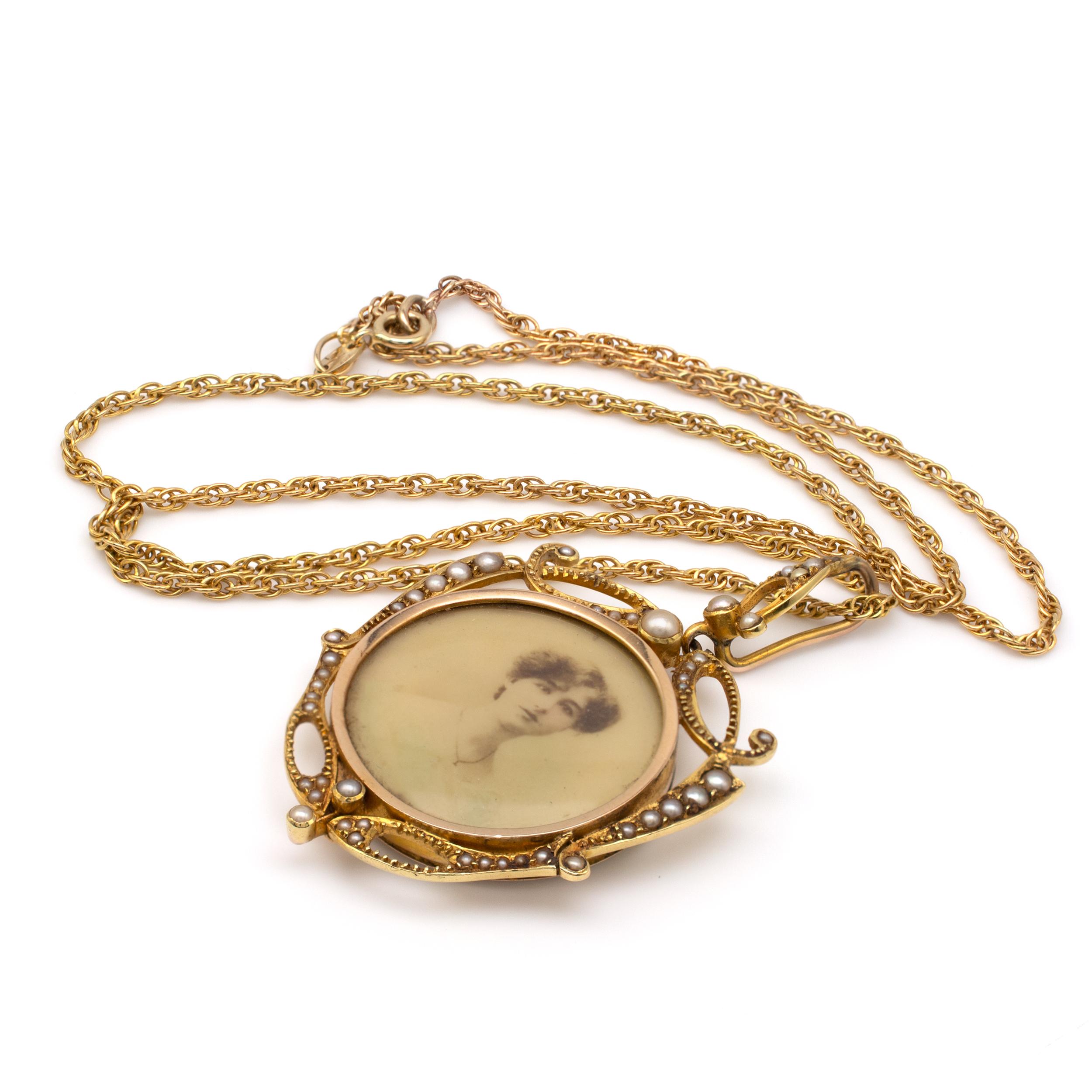 This fine quality Art Nouveau diamond and pearls picture locket pendant is beautifully crafted in 18k gold. 

The antique gold double-sided picture locket is decorated around the side with ornate scrolls set with graduated subtle pearls and