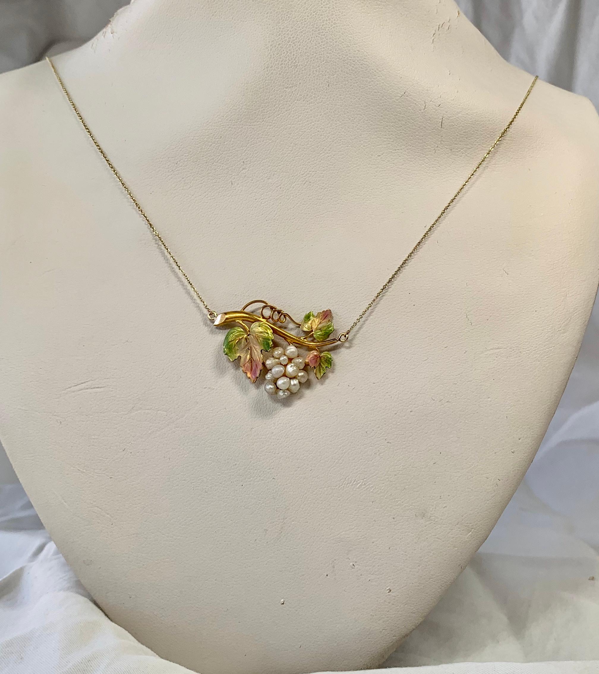 THIS IS ONE OF THE MOST BEAUTIFUL ANTIQUE ENAMEL JEWELS WE HAVE SEEN.  THE VICTORIAN - ART NOUVEAU PENDANT NECKLACE IS IN THE FORM OF A CLUSTER OF GRAPES HANGING FROM THE VINE.  THE GRAPES ARE A CLUSTER OF WHITE PEARLS.  THE GRAPE LEAVES ARE ADORNED
