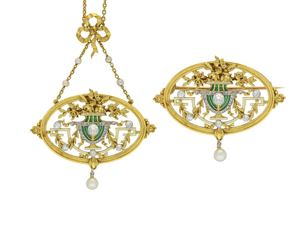 A yellow gold and platinum necklace composed of a horizontal openwork oval pendant with a central urn decorated in stripes of green plique-a-jour enamel and bordered with single rows of seventeen round rose cut diamonds in platinum topped gold