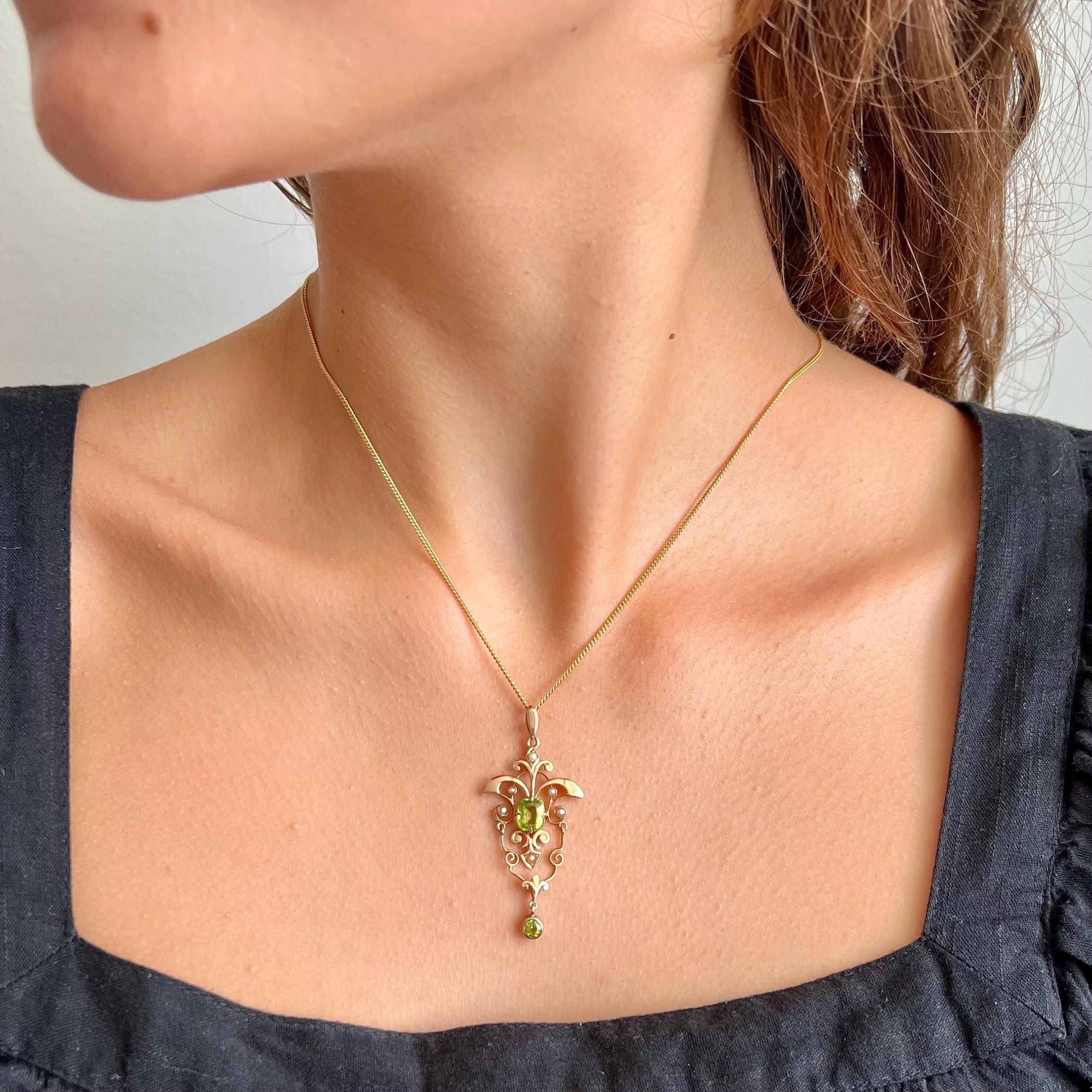 An antique Art Nouveau gold peridot and pearl pendant. This delicate Art Nouveau pendant is made of 14 karat rose gold and set with two fabulous lime green faceted fancy cut peridot gemstones. The pendant consists of a larger square peridot gemstone