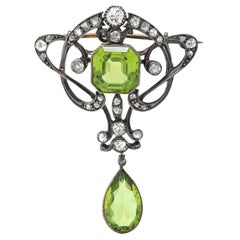 Spilla a frusta in stile liberty con diamante peridoto in oro 14 carati e argento antico
