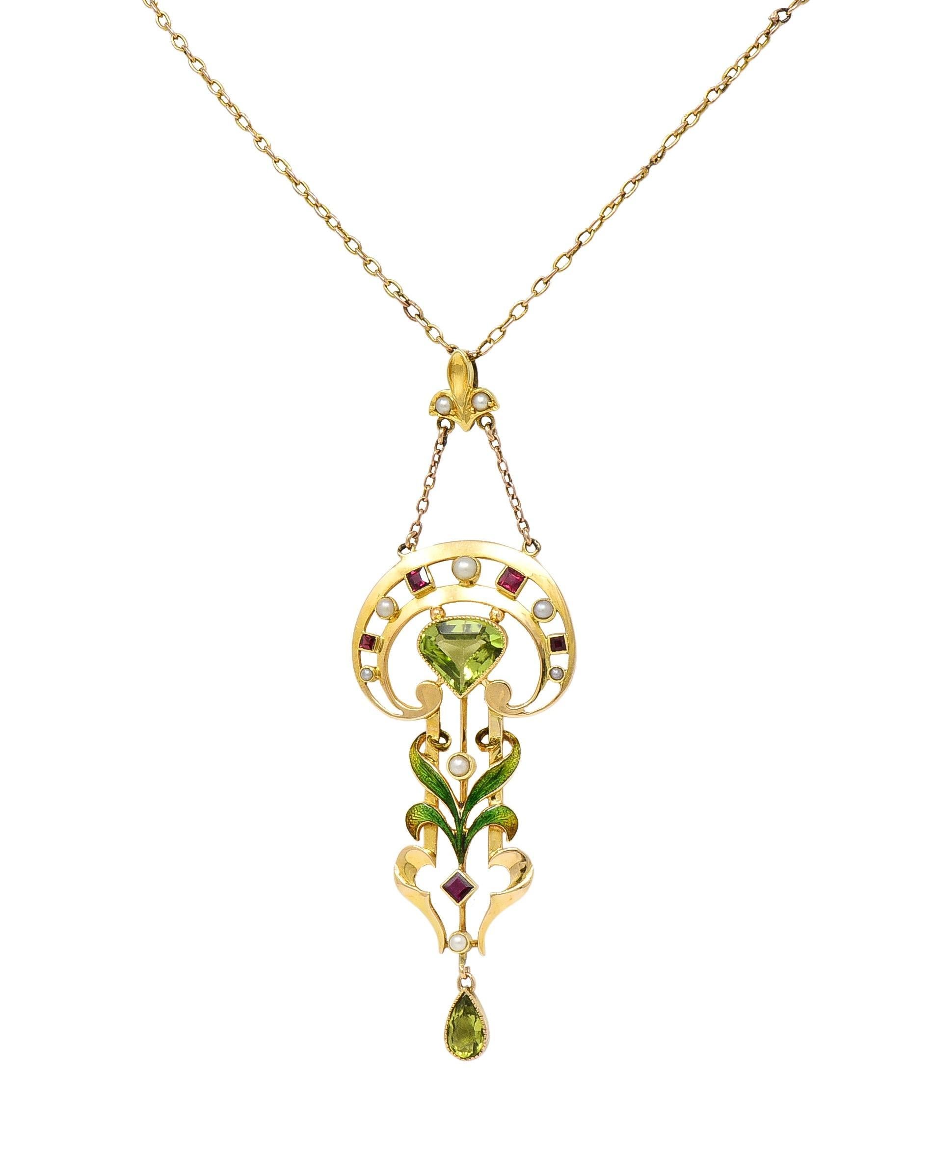 Designed as a cable link chain suspending a pendant from a fleur-de-lis motif bale
Suspending a pierced shield form chain and centering a pentagonal cut peridot 
Weighing approximately 1.50 carats - transparent yellowish green in color 
Well matched