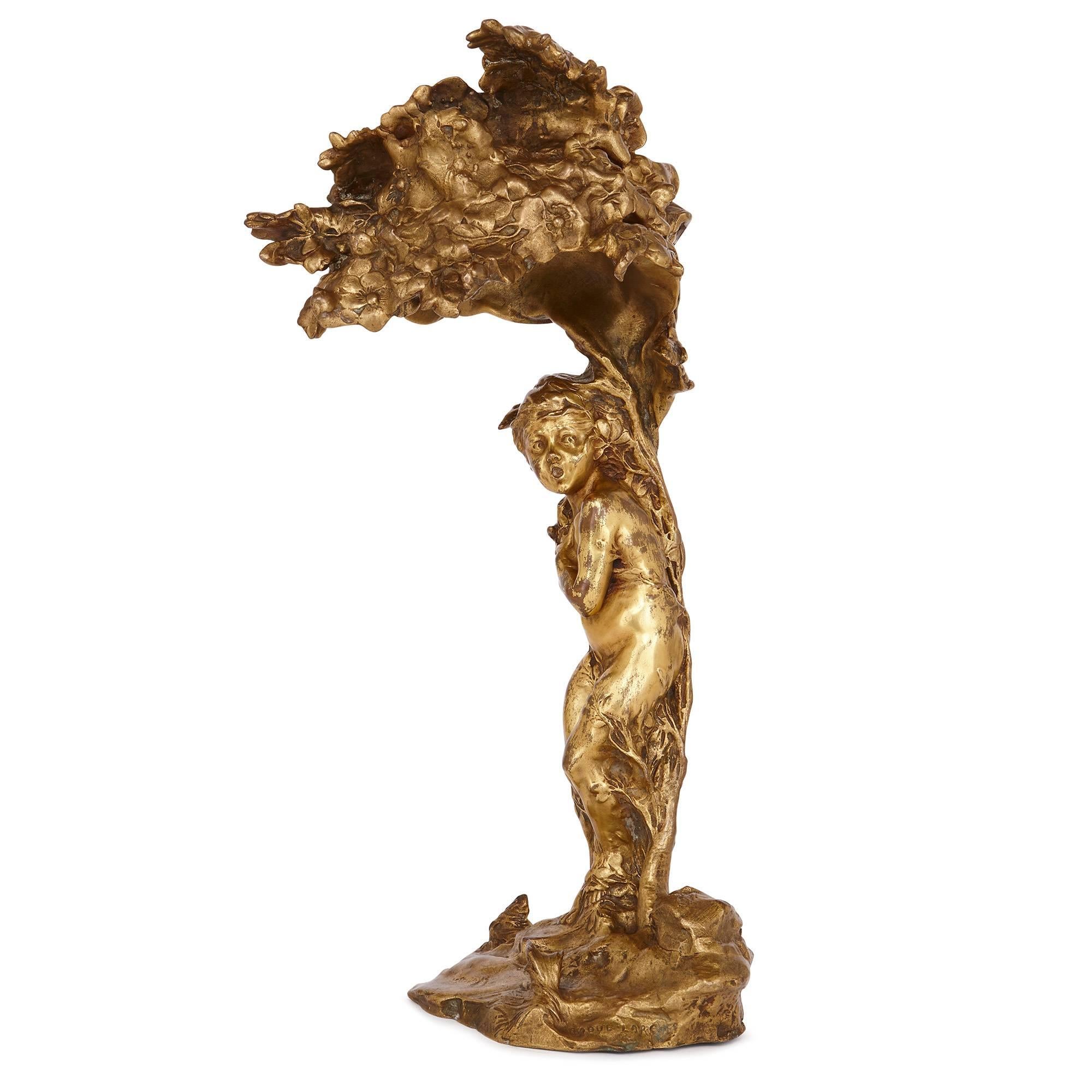 This masterfully cast ormolu table lamp is by Raoul Larche (French, 1860-1912) who was a famous sculpture of the early 20th century. Larche was celebrated for his sculptures of nude women in the Art Nouveau style.
The table lamp, titled 'Le Coup de